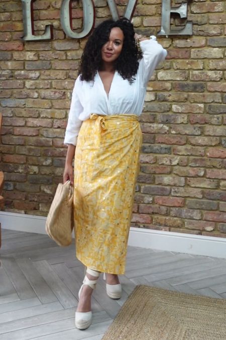 Yellow wrap sarong skirt white linen shirt straw bag white espadrille sandals 