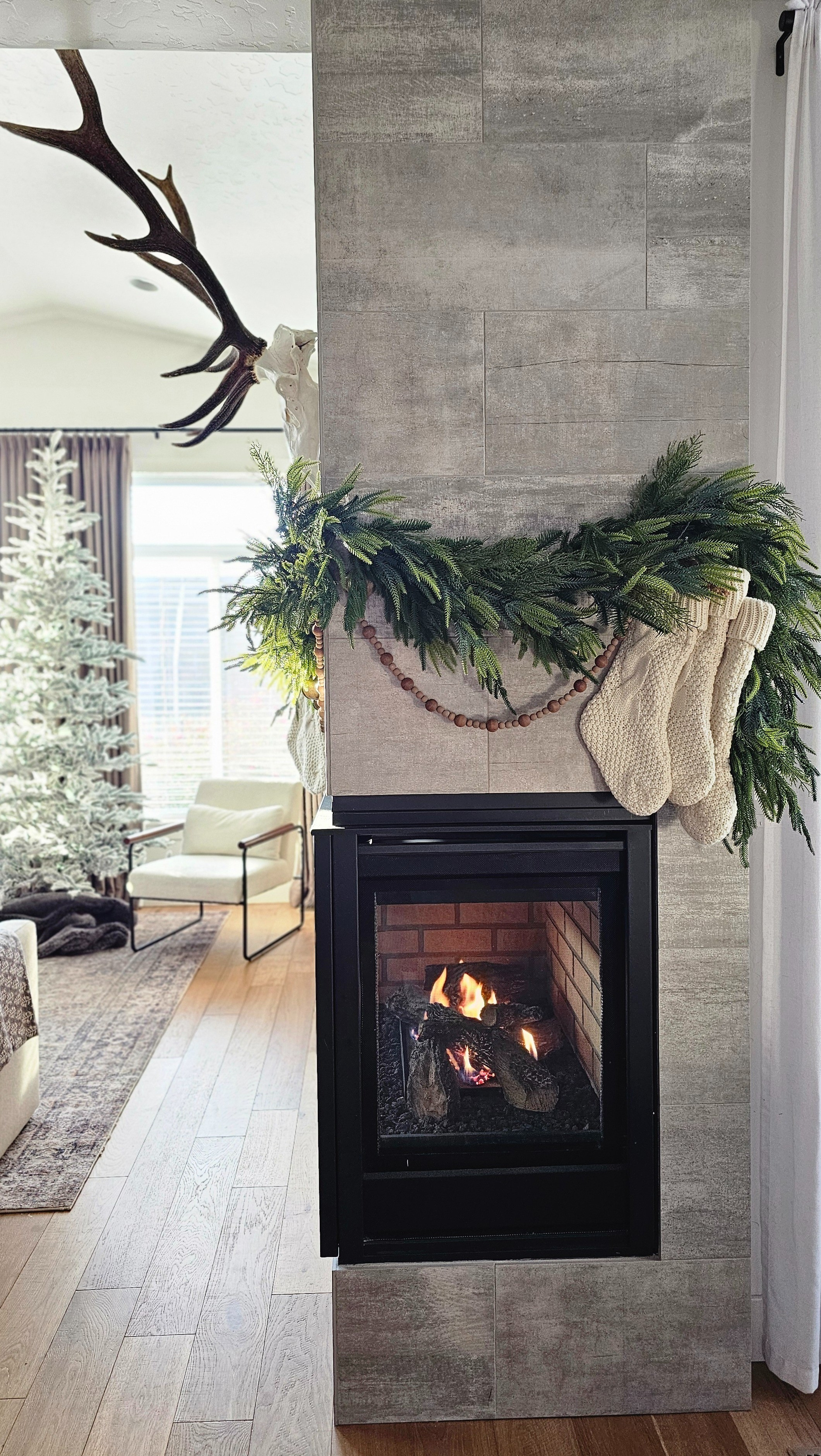 Mantle details. Garland on a corner fireplace. Hanging garland when you don't have a mantle. 

#LTKSeasonal #LTKHoliday #LTKStyleTip