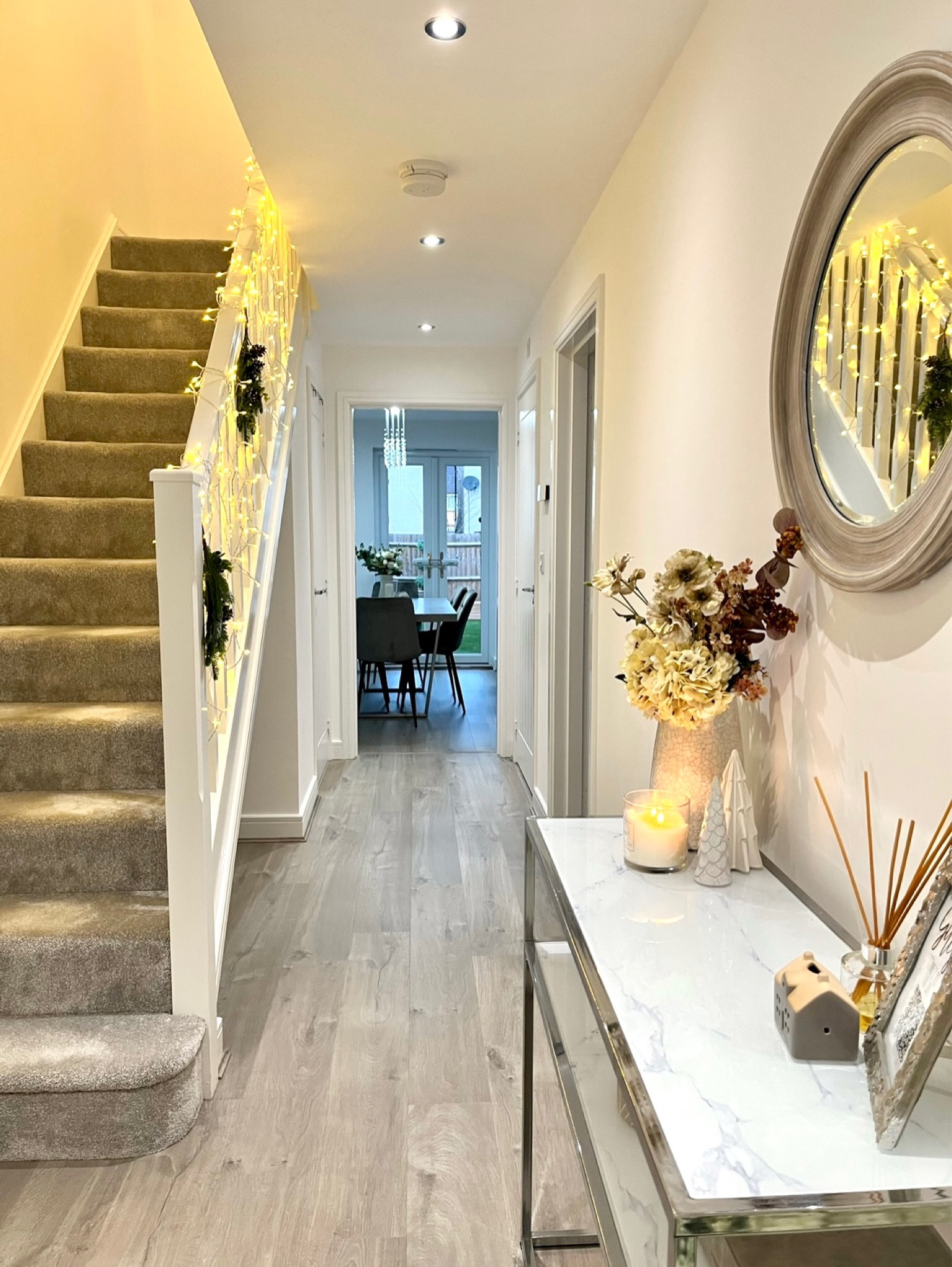 Christmas hallway decorations, Christmas lights, festive decor, hallway inspo, neutral home styling

#LTKwinter #LTKhome #LTKuk