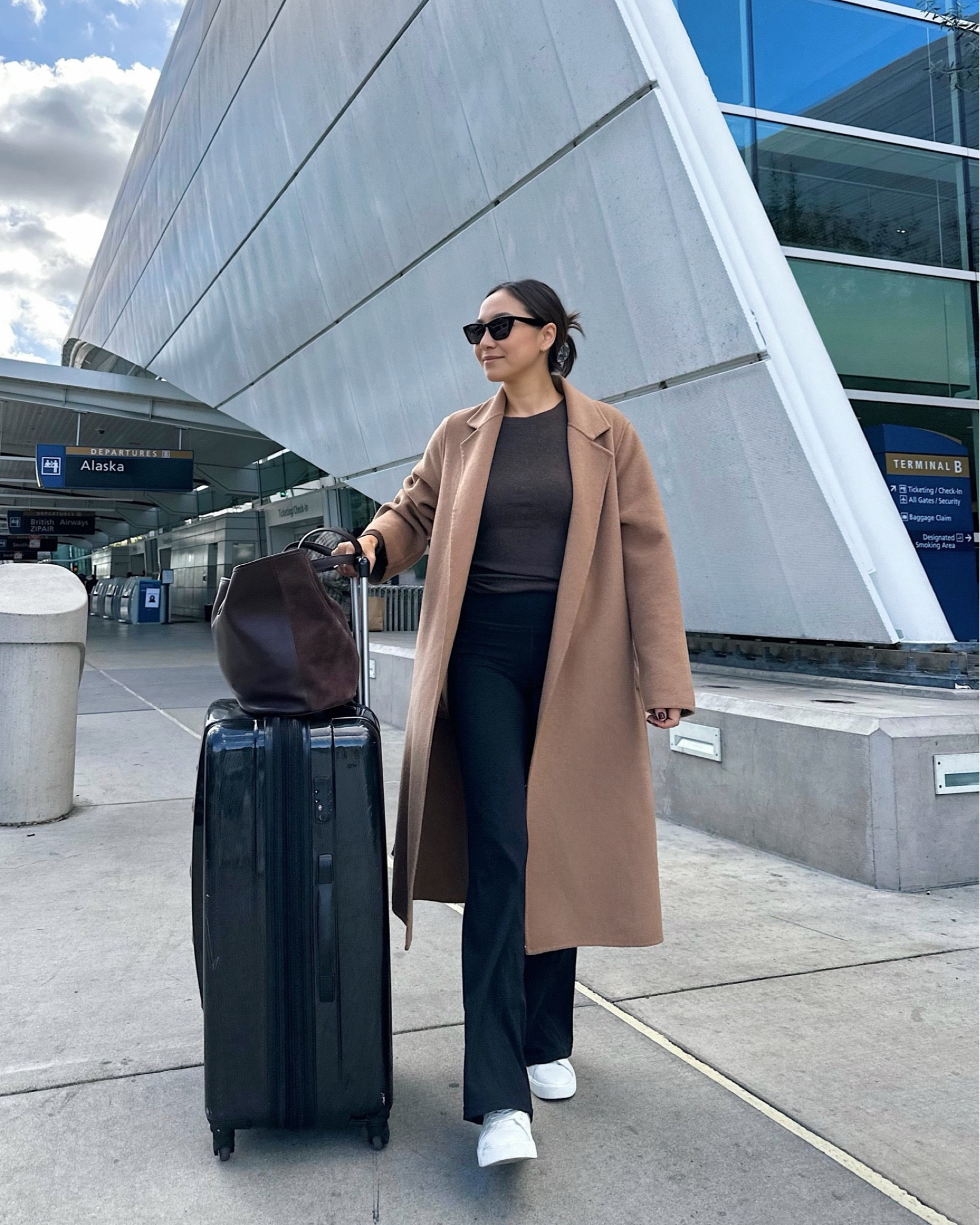 Travel outfit 🖤 

Camel coat xs mango 
Shirt xs Madewell 
Flare leggings xs Athleta 
Sneakers run a half size small 

#LTKstyletip #LTKtravel