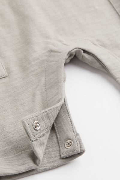 Conscious choice  New ArrivalBaby Exclusive. Sleeveless romper suit in soft, organic cotton slub ... | H&M (US + CA)