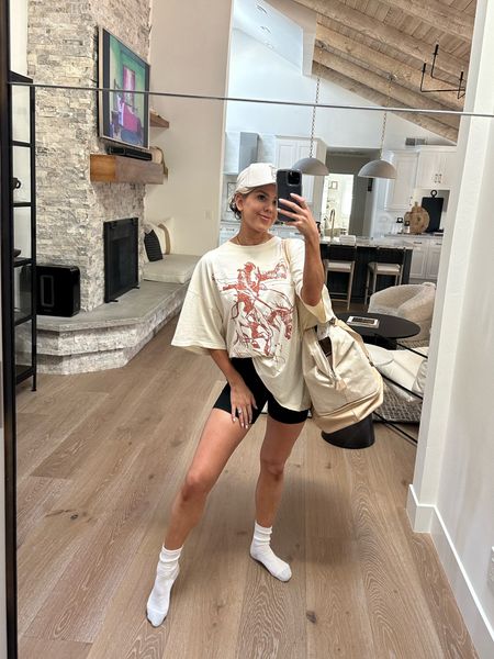Comfy and cozy for the win in this oversized western cowboy graphic tee from revolve (XS).  Wore it with some black biker shorts, a baseball cap, my go to Amazon socks and my favorite Beis weekender tote bag 

#LTKitbag #LTKfindsunder50 #LTKfindsunder100