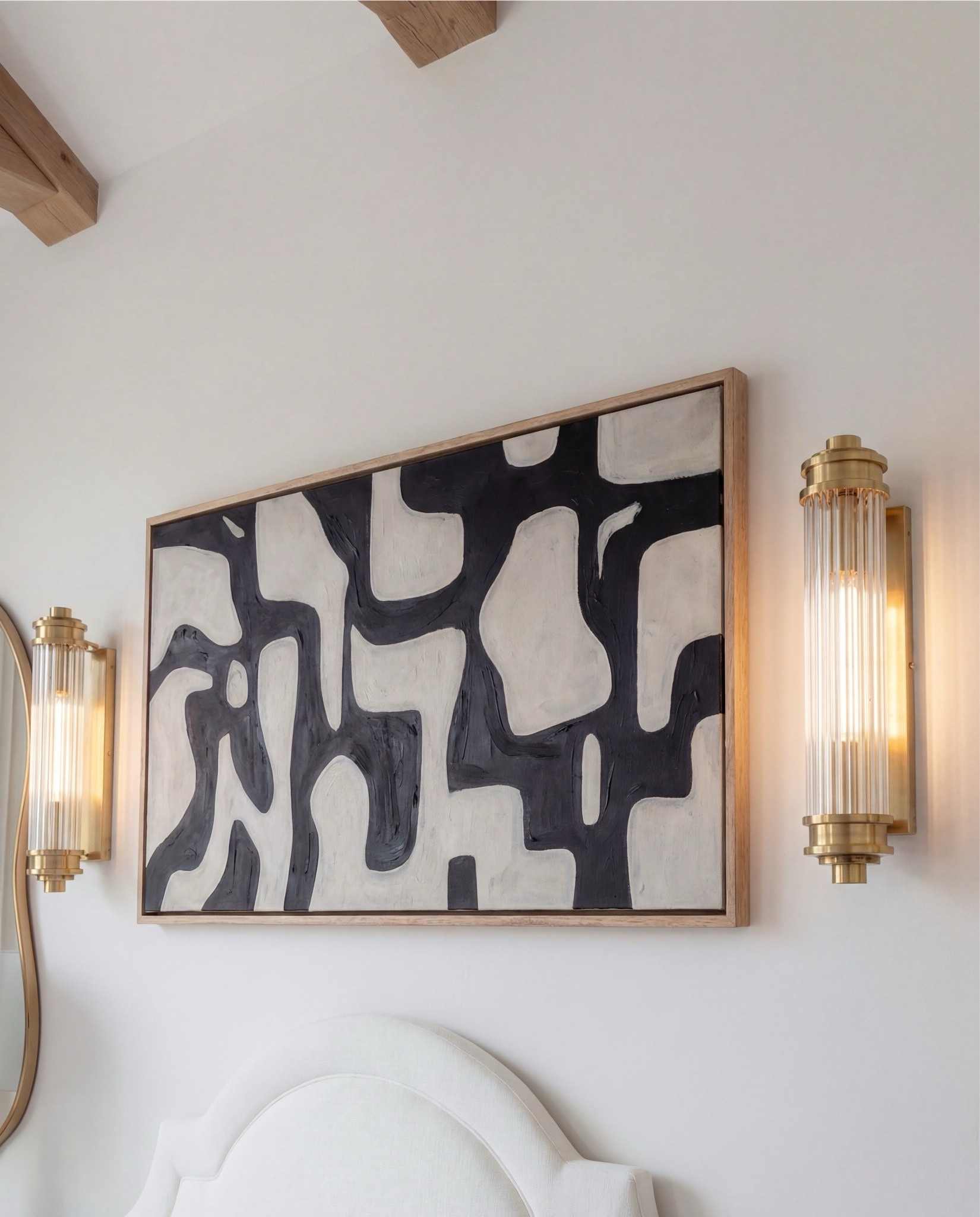 Shop the Look:
• White upholstered arched headboard bed
• White cotton duvet cover + pillow shams
• Green vintage-style area rug (distressed pattern)
• Brown chunky knit throw blanket
• Dark wood nightstands with cane doors
• White ceramic table lamp (round base)
• Brass wall sconces with glass shades
• Organic shape gold wall mirrors
• Black and beige abstract framed wall art
• Green geometric throw pillows
• Upholstered brown bench (channel tufted)
• Dark wood dresser with brass pulls
• Round ivory accent chair
• Cream throw blanket (soft knit texture)
• Tall brass floor lamp with white shade
• Decorative book stack (neutral tones)
• Small wood decorative box
• Brass round tray
• White pedestal decorative bowl
• Marble candle holders with brass rings
• Taper candles (ivory)
• Large ceramic vase with dried stems

#LTKHome #LTKSaleAlert