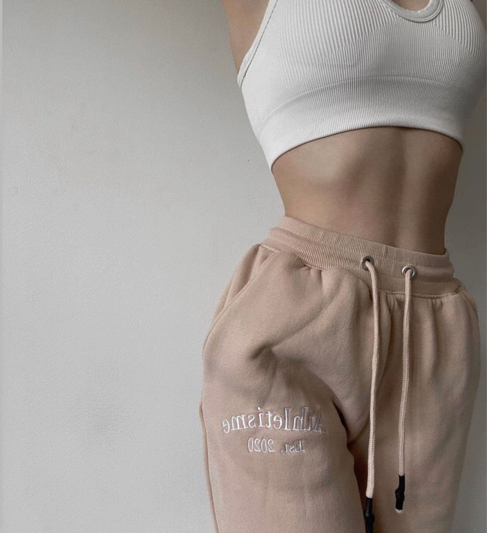 This top comes with matching leggings on Amazon. I was surprised with how thick and comfortable it is for the low price! Highly recommend.
.
Low priced white rubbed sports bra cropped top from Amazon, Thick material, tan camel beige sweatpants, joggers, workout fit, neutral yoga set, cute comfy clothes 