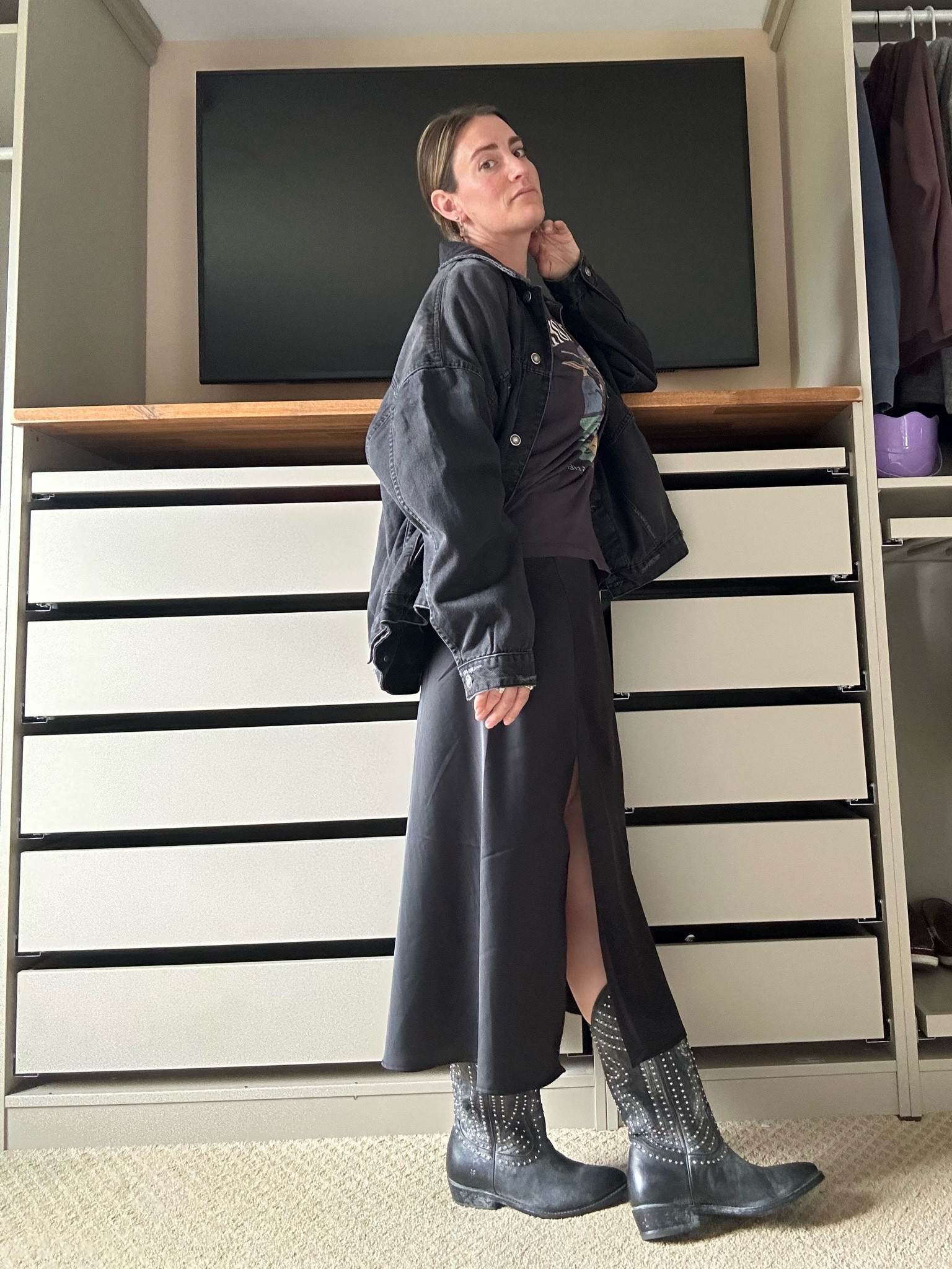 Black Out 🖤
.
I love a good black out…that doesn’t have you hung over in the morning 😅 Enter my black on black rough and tumble look. Good for a night on the town, a country concert, or a days walk about! 
.
A graphic tee over a satin slip dress, studded cowboy boots, and an oversized denim jacket and you’re ready to go.  

#LTKParties #LTKShoeCrush #LTKSummerSales