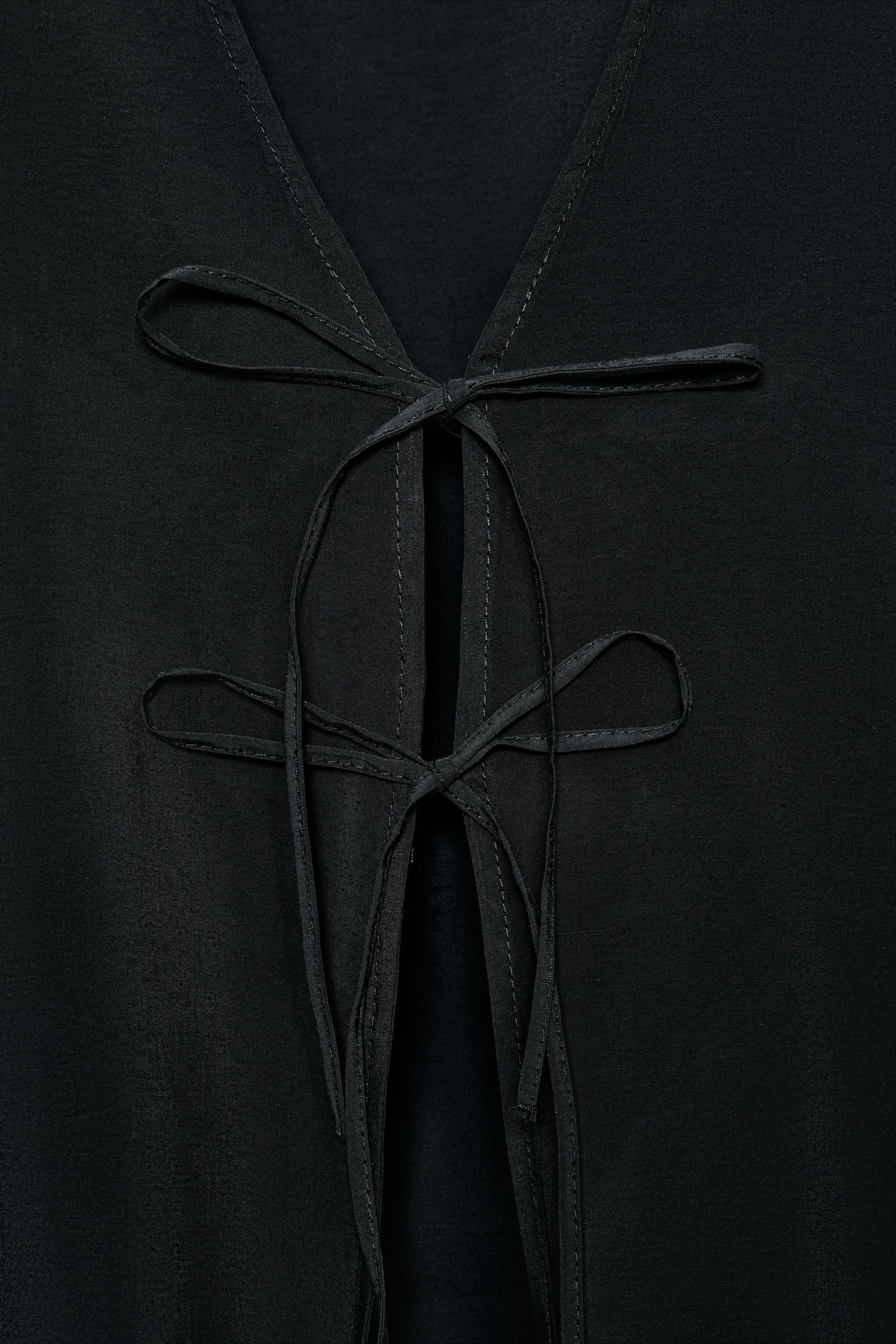 V-neck shirt with long sleeves. Front tie closure. | Zara US
