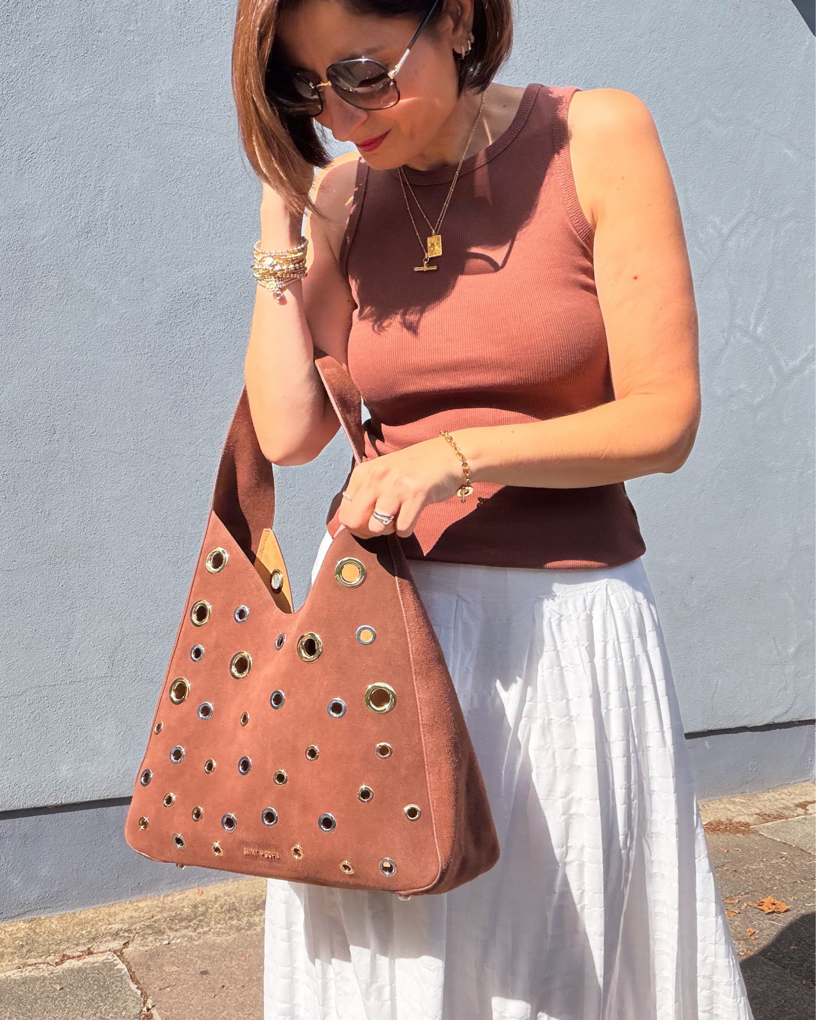 The bag makes the outfit. Wearing a 10 in the skirt & 8 in the top. Perfect with a jacket as it cools down a bit.

#LTKuk #LTKsummer #LTKautumn