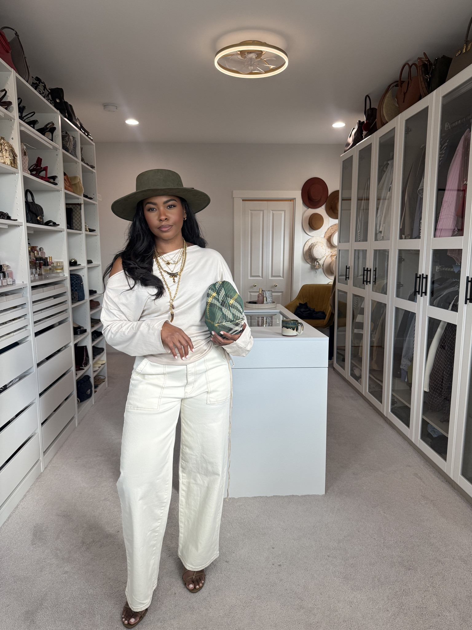 top: M Amazon
pants: 12 Walmart
Hat & Jewelry: www.shoplivinfearless.com
Bag: Burberry
Sandals: Zara 

 