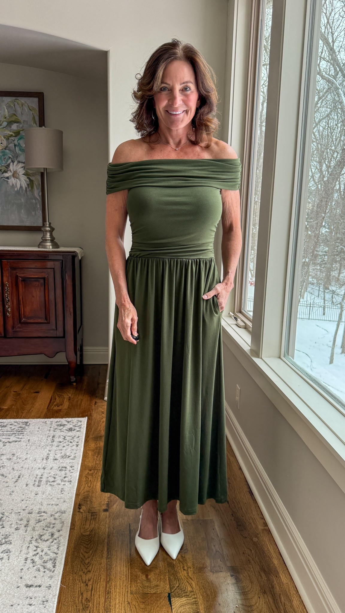 Dark green off the shoulder elegant maxi dress for special occasions .

This off-the-shoulder olive midi is a power neutral — structured through the bodice, fluid through the skirt. It highlights the neckline while keeping the silhouette refined.

Why it works:
• Draped neckline = soft drama
• Defined waist creates shape
• Classic heels sharpen the look

Strong shape. Rich color. Minimal extras.

#AmazonFashion #StyleOver40 #ModernMidlifeStyle #EffortlessElegance #ConfidentStyle