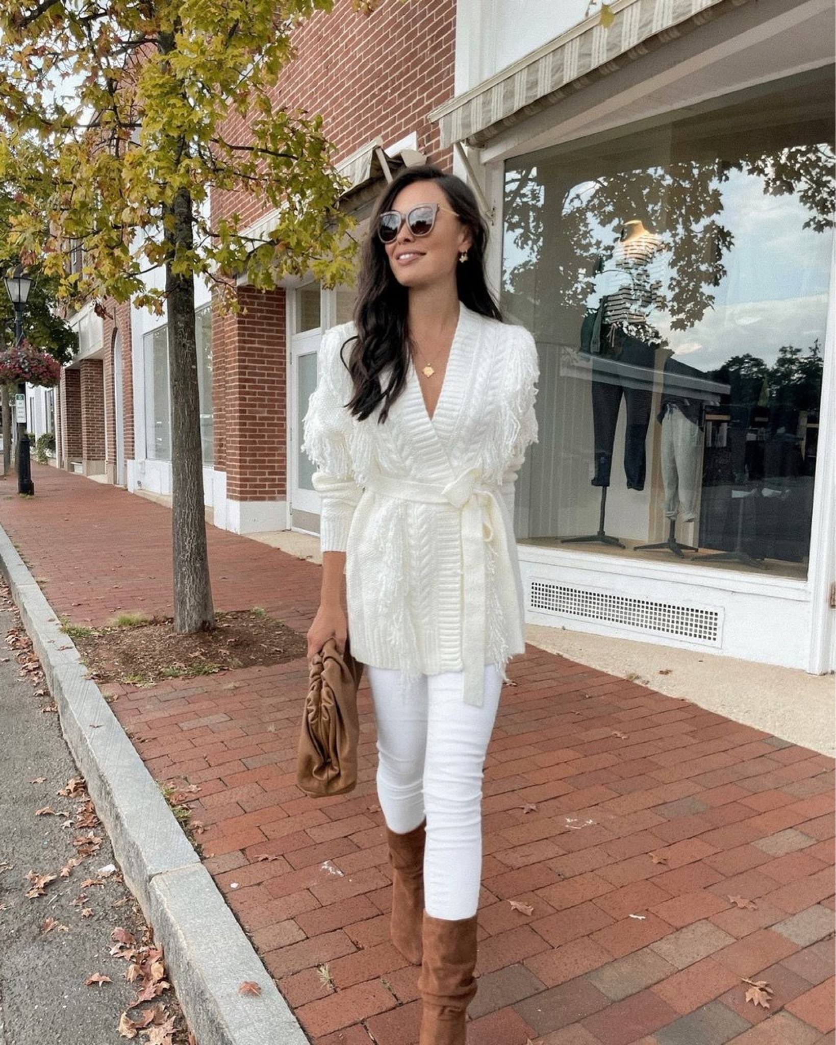 Kat Jamieson of With Love From Kat wears a fall outfit. White sweater, tan boots, suede boots, white jeans, tan handbag, fall style. 

#LTKSeasonal #LTKshoecrush #LTKstyletip