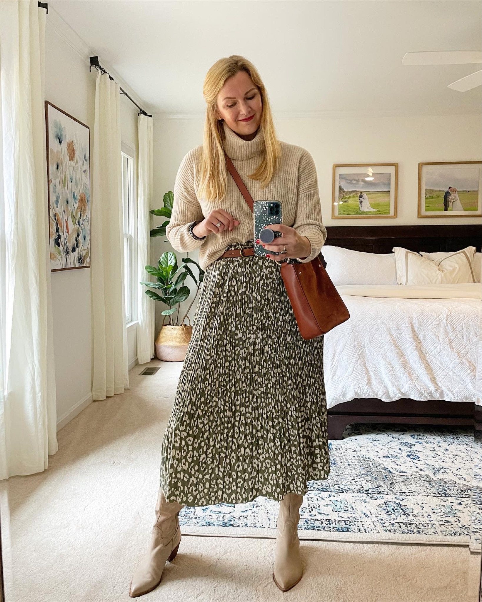 Neutral holiday party outfit idea 

Turtleneck sweater with pleated green leopard skirt (one of my fav amazon finds!) paired with crossbody bag and knee high suede boots 

#LTKfindsunder50 #LTKSeasonal #LTKHoliday