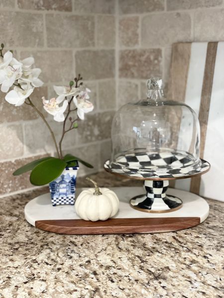 Small faux orchid. MacKenzie-Childs stand. Crate and Barrel marble cutting board. White pumpkins.

#LTKhome #LTKHalloween