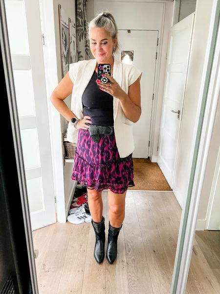 Outfits of the week. The black viral bra top from Uniqlo paired with a dark pink leopard print skirt (old Shoeby) a beige vest (local market) and black Marant style western boots. 

#LTKmidsize #LTKstyletip #LTKcurves