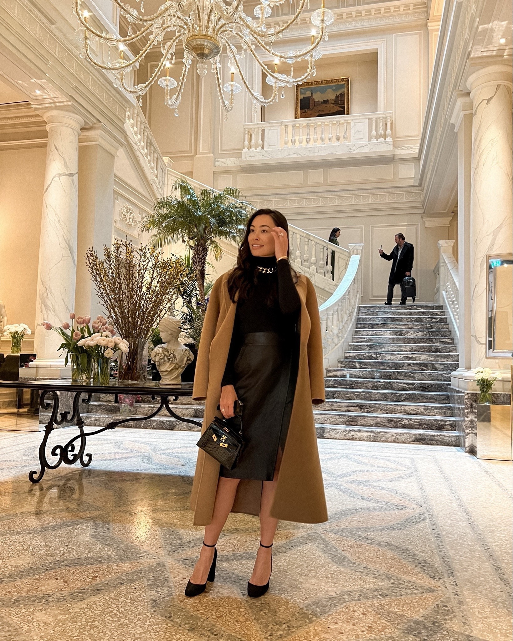Kat Jamieson wears a leather skirt, turtleneck and camel coat. Holiday style. Skirt is BASH (old, similar below) and heels are Aquazzura (old, similar below.)

#LTKshoecrush #LTKHoliday #LTKSeasonal