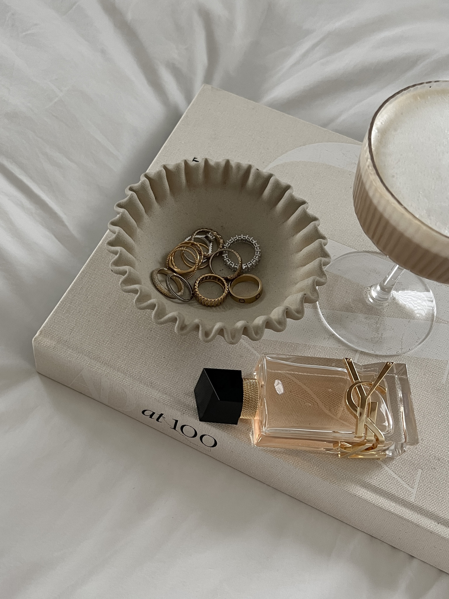 Ysl perfume. Saint laurent Libre. Ripple ribbed shell bowl, ribbed glasses glassware cocktail cups, AD 100 architectural digest coffee table book. 

#LTKbeauty #LTKhome #LTKunder50