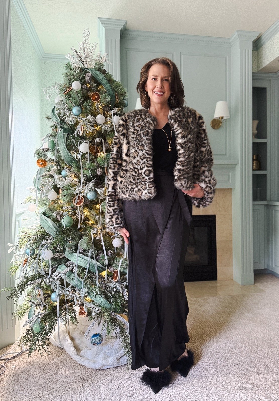 A dressy-casual look for the holidays! I’ve paired sating wide leg pants and black top with a cheetah print faux fur coat. These products are no longer sold online, but I’ve linked similar options below! 

#LTKOver40 #LTKootd #LTKHoliday