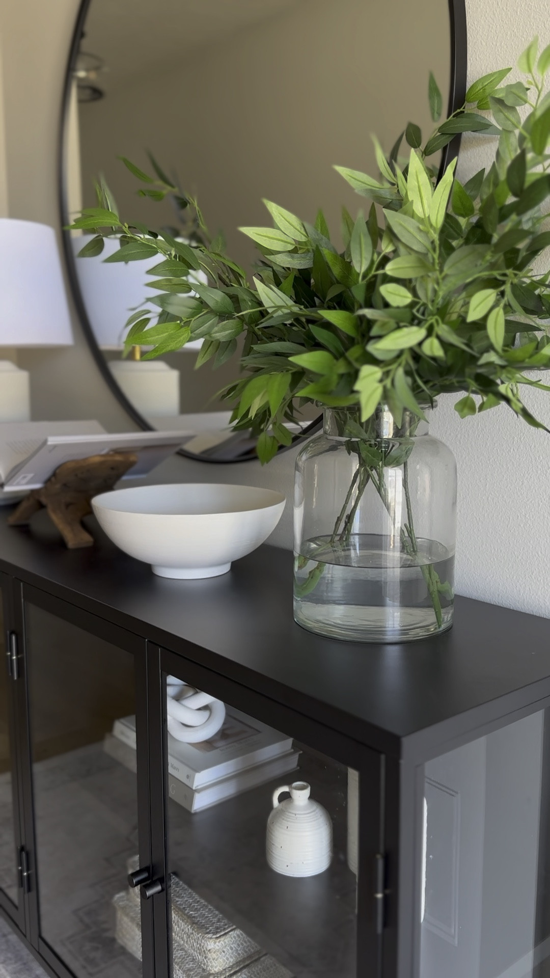 Use water with your faux stems to make them look real! I love how big this vase is. I have two boxes of stems here! Make sure you straighten and fluff your stems. Adjust and move around leaves if needed.

Stems and vases, home decor, home design, entryway, console table, glass cabinet 

#LTKHome #LTKSummerSales #LTKStyleTip