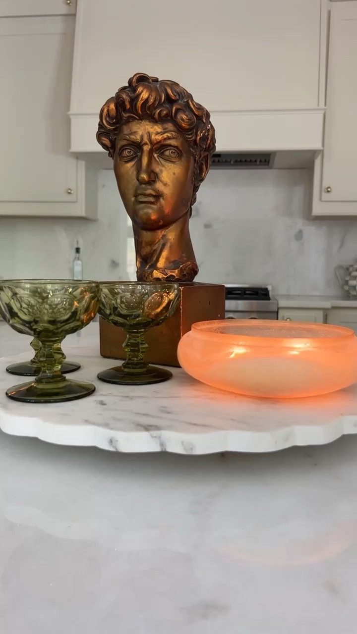 Home decor favorites this week! This new anthro candel smells incredible, perfect for spring. 

#springcandle #springhome #greenglassware #marble #springfinds 

#LTKhome #LTKstyletip #LTKunder100