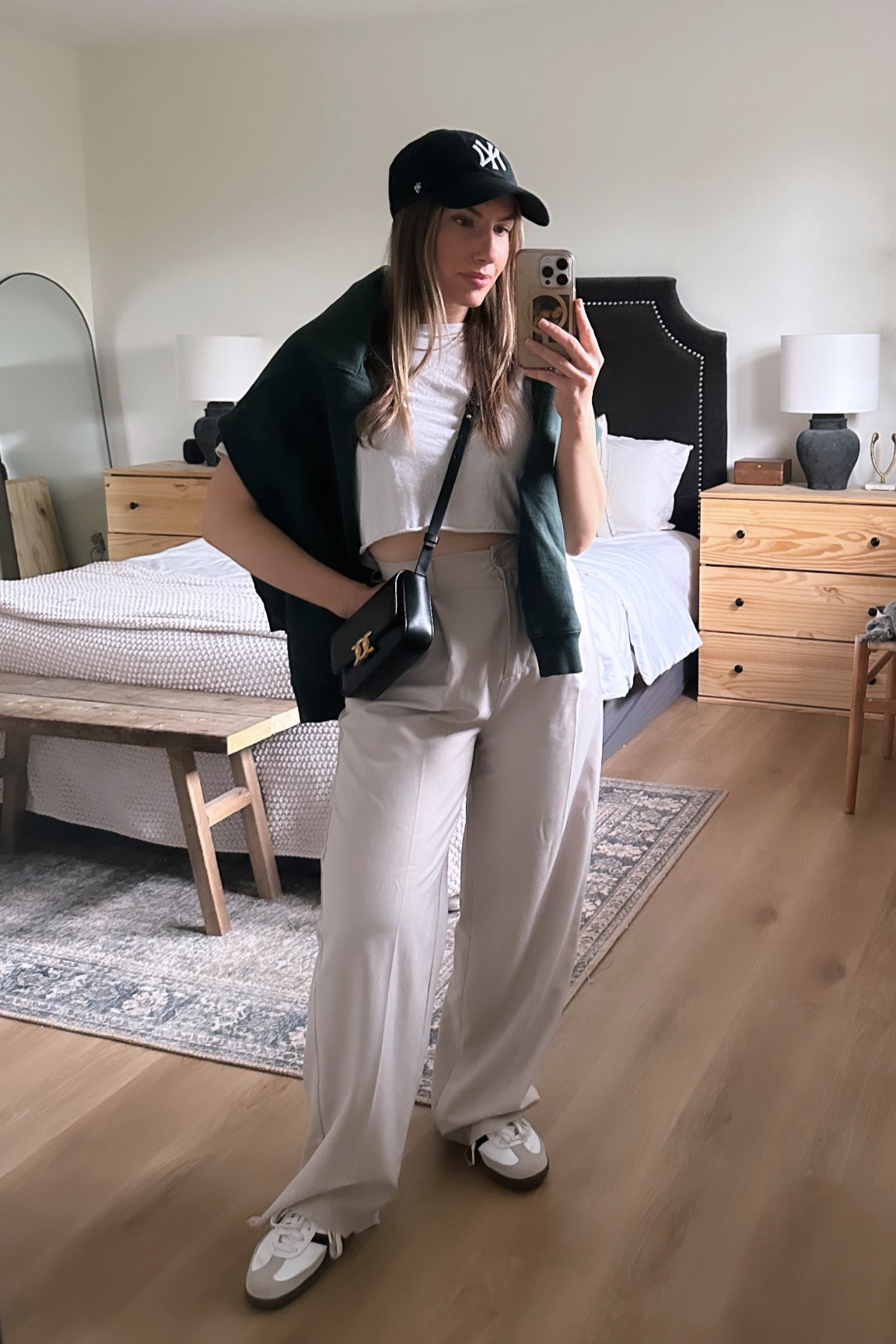 Cool dressy casual outfit. 

Black ball cap, white crop top, dark green sweater, white leg trousers, black purse, white sambas 

#LTKcanada #LTKstyletip #LTKsummer