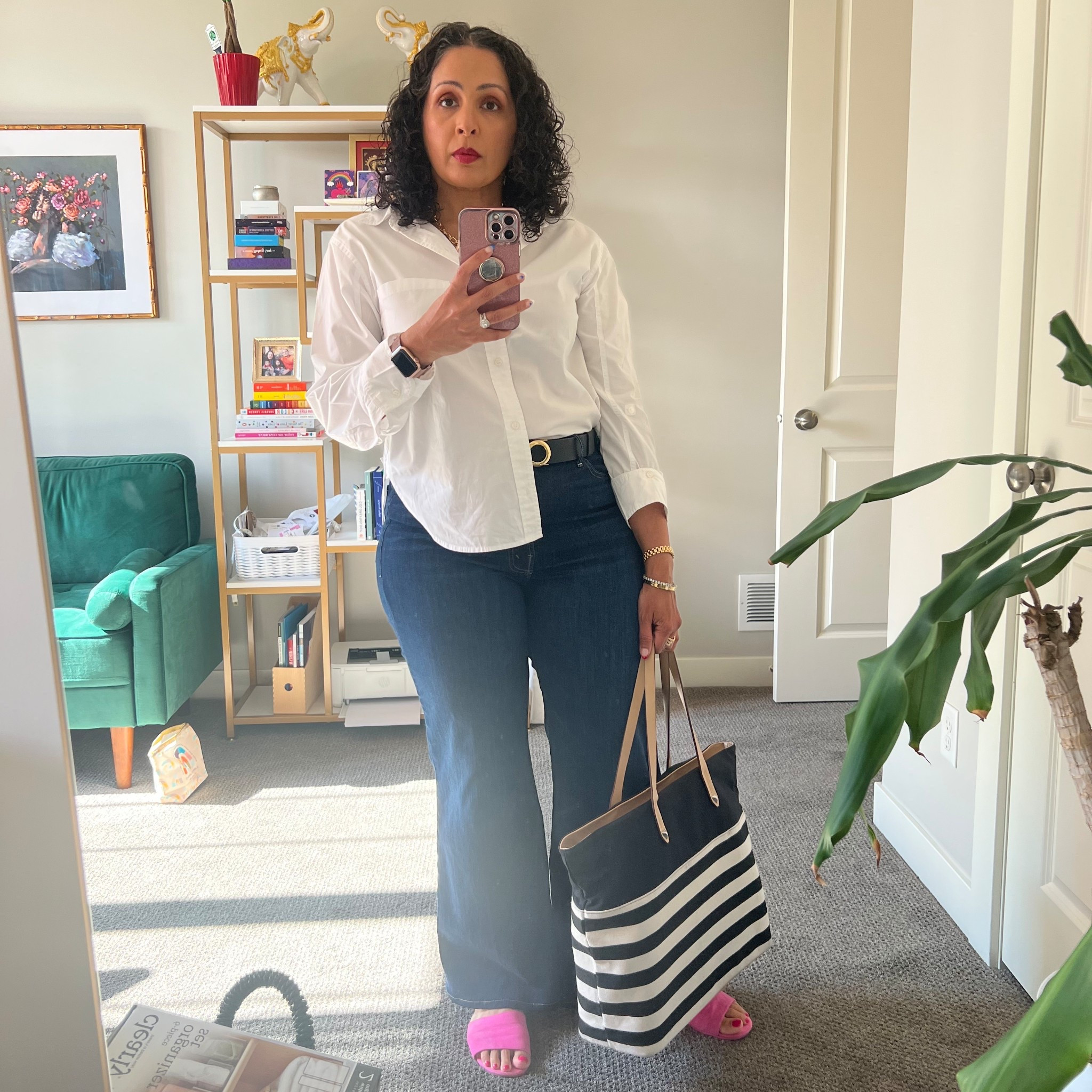 A case for tucking it in.

The proof is in the photograph. The side where the shirt is untucked looks messy and sloppy. 
The side where the shirt is tucked in looks instantly pulled together, even in the simplest outfit in everyone’s wardrobe- jeans a a white button up shirt.
T
A tucked in shirt, a cuffed sleeve, adding a belt, a statement handbag and a pop of color with the sandals takes this look from basic to elevated. 
Are you going to try this at home? Tag me when you do! 

#LTKOver40 #LTKStyleTip #LTKMidsize