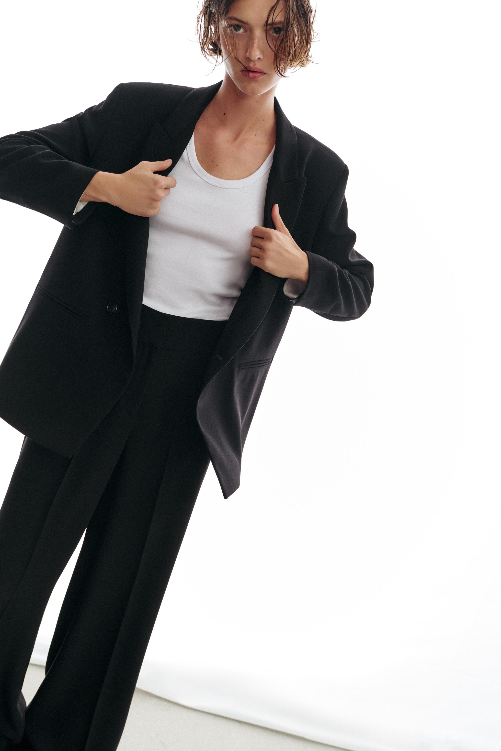 Model height: 176 cmHigh-waist trousers with front pockets and false welt pockets at the back. Wi... | Zara UK