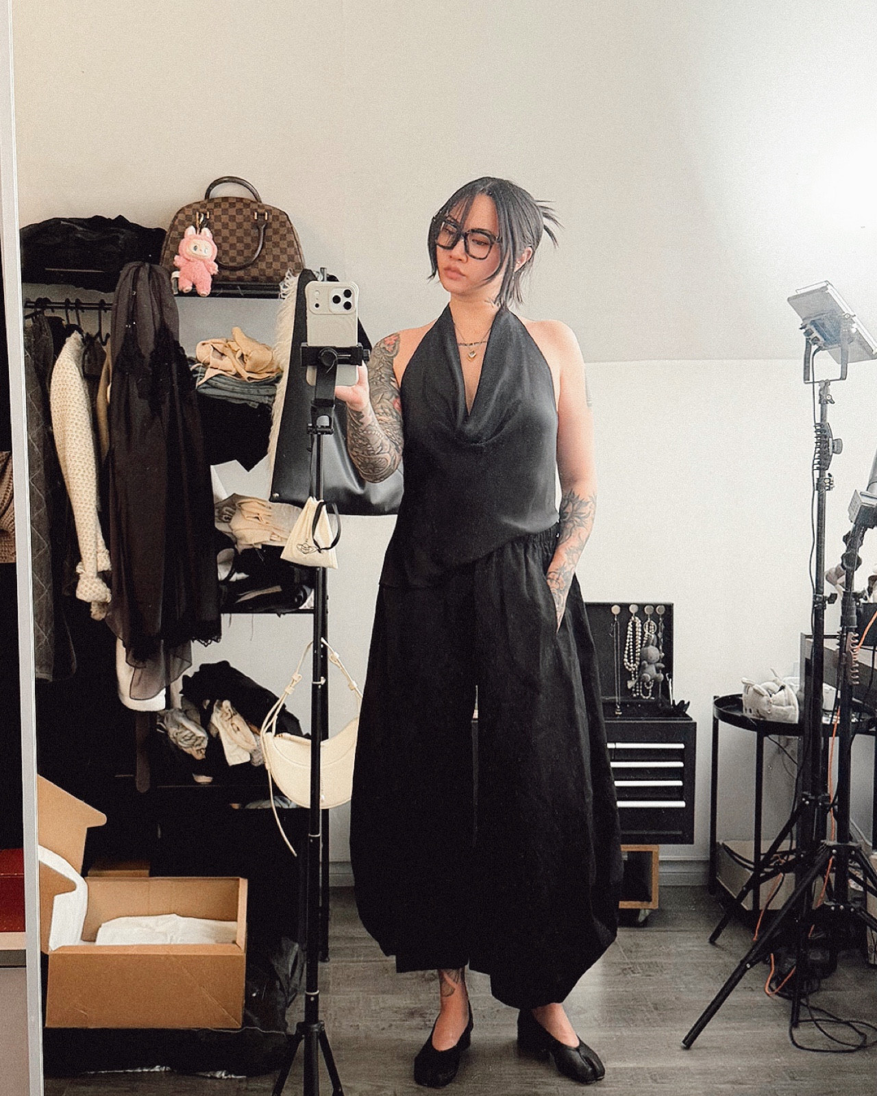 Zara Satin effect black backless halter top — 2 satin strings to tie at the back for a sexy holiday party top. You can also adjust how low you want the top to go 😉 paired with black barrel, flowy, volume wool pull-on pants. Nice for casual wear. Has stretch. Soft enough for comfort yet holds structure and flow. 5’7, both size medium  #allblackoutfit #pullonpants #barrelpants #widepant #satintop #haltertop 

#LTKFindsUnder100 #LTKFindsUnder50 #LTKootd