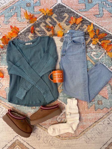 Who is ready for PSL season?🎃🧡Today’s temps have me so excited for outfits like this one!🥰🍁🎃🧡 These jeans have become a staple in my wardrobe, and I always am in the market for a good thermal. This one even has thumbholes for that extra cozy factor!🥰 If in between sizes on the Uggs, I recommend sizing up half. Uggs are fully stocked in all sizes but one, and my coffee mug is only $5!!😍🎃🧡☕️☕️☕️
.
.
Sizing: 
Thermal: tts 
Jeans: go down one to two sizes depending on how tight you want them to fit. I went down one size and they are still slightly slouchy and will stretch some. 
Uggs: size up half if in between 
.
.

#fallstyle #fallfashion #fallstyleinspo #fallinspo #simplestyle #ootd #ootdguide #ootdfash #falltransition

#LTKshoecrush #LTKfindsunder100 #LTKSeasonal