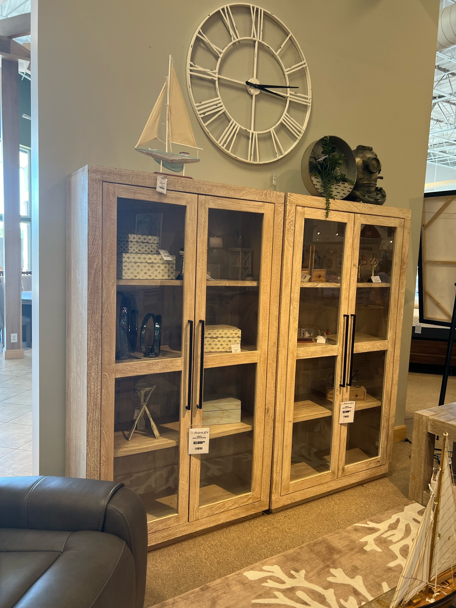 Accent cabinet from Ashley Homestore on sale now! White wash finish, natural wood grain. Mango wood, glass panel door fronts, bronze tone oversized metal door pulls.

#LTKstyletip #LTKsalealert #LTKhome