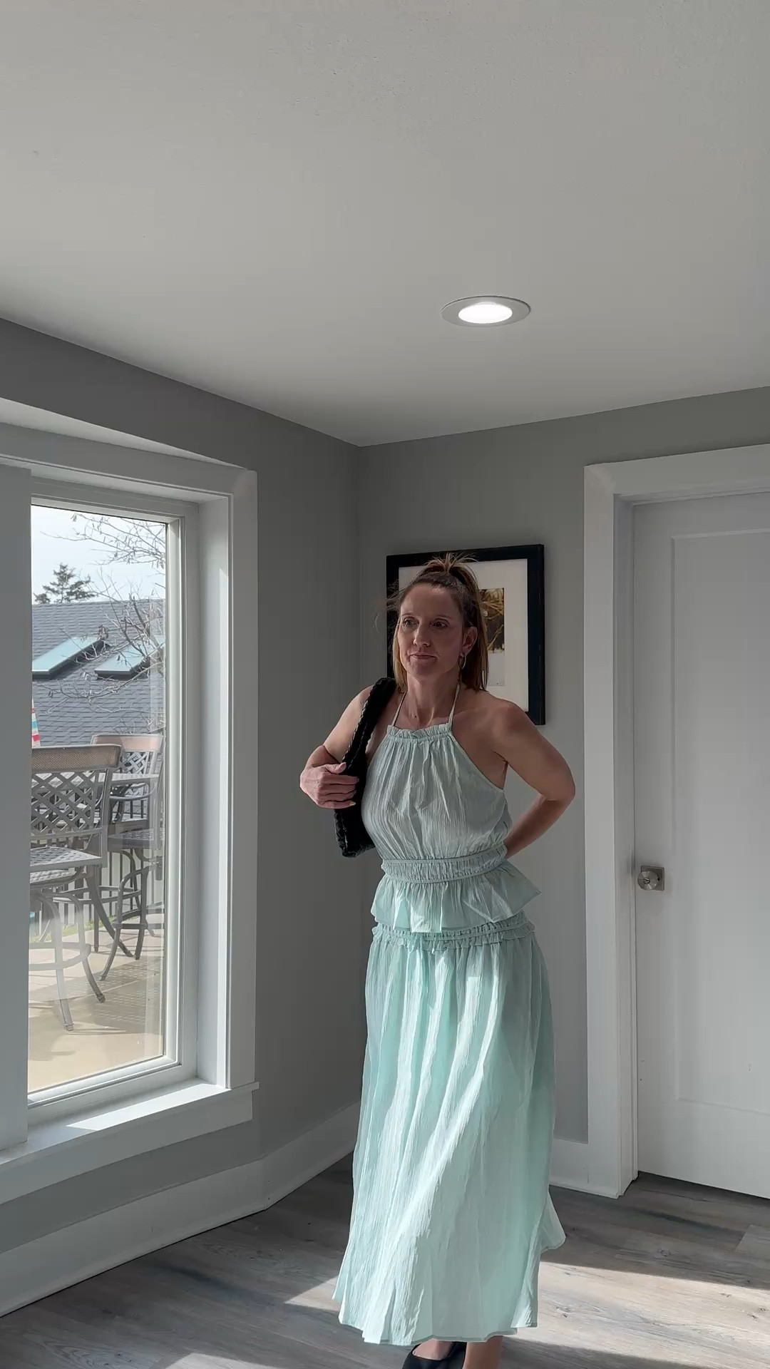 Sticking to soft tones and simple details for a polished daytime look. 🎀🌿 This matching set is my secret to looking completely put-together while staying cool and comfortable. Check out the link in my bio to shop this look and refresh your own warm-weather rotation! 🌟 #StyleInspo #PastelAesthetic #EffortlessChic #ShopMyLook

My Pastel Perfection Style Breakdown
• The Set: I’m wearing a pale mint green matching set featuring a smocked bodice top with ruffle details and a flowy, tiered midi skirt.
• The Accessories: I’ve styled the look with a black woven shoulder bag, adding a touch of texture and a dark contrast to the light pastel.
• The Footwear: To keep the look grounded and classic, I finished it with my favorite black Mary Jane flats.
• The Hair: I’ve opted for a high, textured ponytail with a black scrunchie to keep the aesthetic clean and modern.
• The Vibe: This is the definition of "romantic casual"—it’s light, airy, and perfect for a spring garden party or a weekend brunch.

Mint green matching set, tiered midi skirt, smocked ruffle top, pale green dress, black woven shoulder bag, black Mary Jane flats, spring pastel outfit, romantic casual style, breezy summer fashion, LTKstyle

#LTKootd #LTKOver40 #LTKmomlife