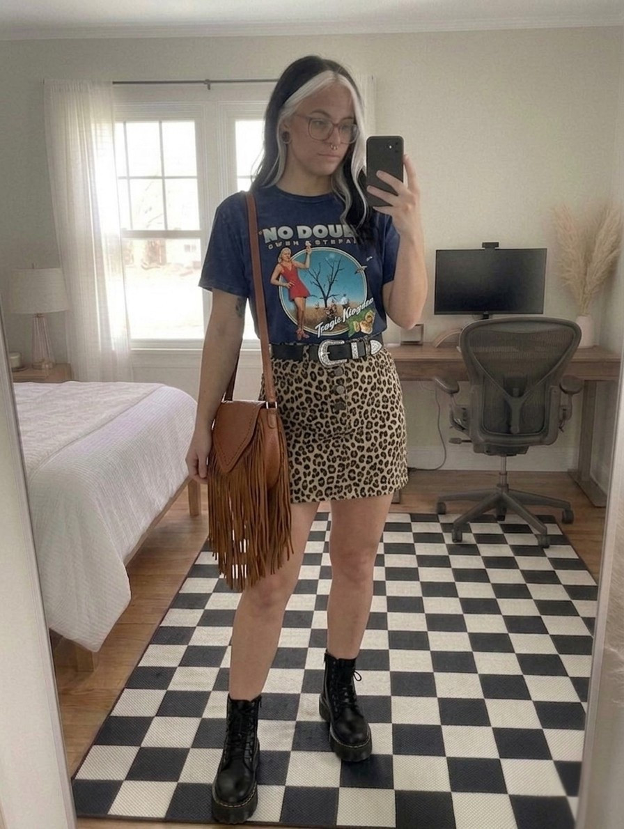 Obsessed with this 90s-inspired transition look! Taking my favorite Dr. Martens Quad platforms and pairing them with a vintage No Doubt Tragic Kingdom tee and a structured leopard mini skirt. The Western buckle belt and fringe crossbody add that perfect touch of boho-grunge. This outfit is all about mixing patterns and textures for a high-impact street style vibe.

#LTKootd #LTKSeasonal #LTKMidsize