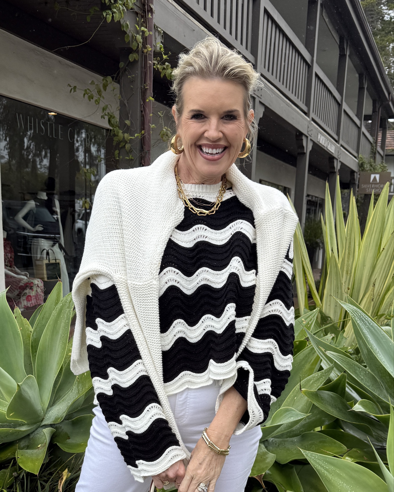 Coastal breeze
Spring outfit inspiration 

Nothing like  fresh black and white Outfit. It’s fresh yet chic✔️

This daring bel sleeve chevron black and white  stripe sweater is daring, light weight and tts. I am in a small🤍 so affordable 

No stain white jeans… yes no stain! These are a slim straight leg with frayed hem by Chicos and fit tts 

Chloe straw tote on major sale right now!
I have loved mine for years and it makes a great spring & summer tote 

Jeffery Cambell gold detail black sandals… so cushioned and comfortable tts
(They now have designer inspired and I’ll link those too) 

White knit sweater over my shoulders (mine has a flag on it) I just turned it around! 

Gold earrings Amazon find unde $12 

Gold necklaces and bracelets mix of reel gold, Allie Bess, Allen Taylor, Julie Vos 

#LTKTravel #LTKOver40 #LTKStyleTip