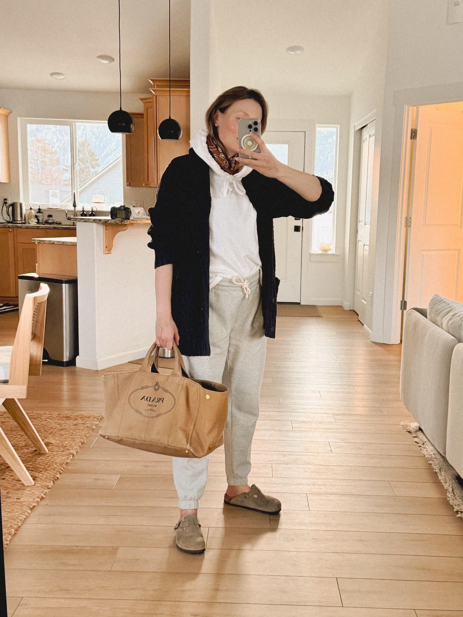 2nd week postpartum, I live for casual clothes these days! So thankful for the fisherman’s aesthetic so I can wear my cozy clothes with a bit of a seafarer twist. Wearing James Perse cotton pullover hoodie (similar style Lands End long sleeve slub hooded pullover ) + Gap Vintage soft classic joggers + Birkenstock Boston clogs + Prada Canapa (linked from The Real Real, similar styles available by Sézane and Vanessa Bruno) +  L.L. Bean men’s signature cotton fisherman sweater + Madewell silk oversized bandana. 

#LTKItBag #LTKStyleTip #LTKSeasonal