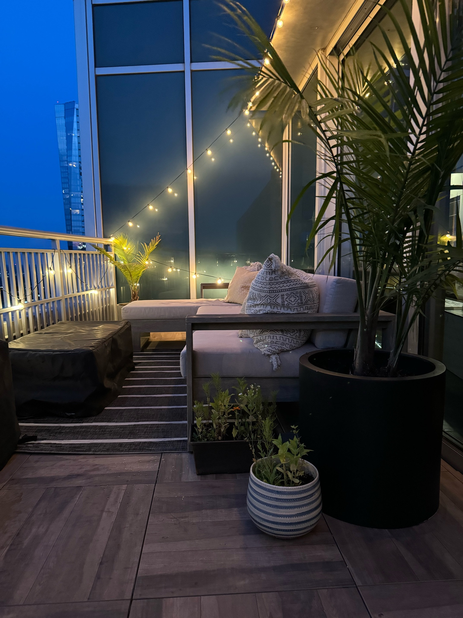 Outdoor balcony/patio space  inspiration. Outdoor sectional is customizable for your space from West Elm. The outdoor set is expensive but is doing great after 3 years. Fire pit & cover are from Wayfair. Outdoor rug from Target .

#LTKHome