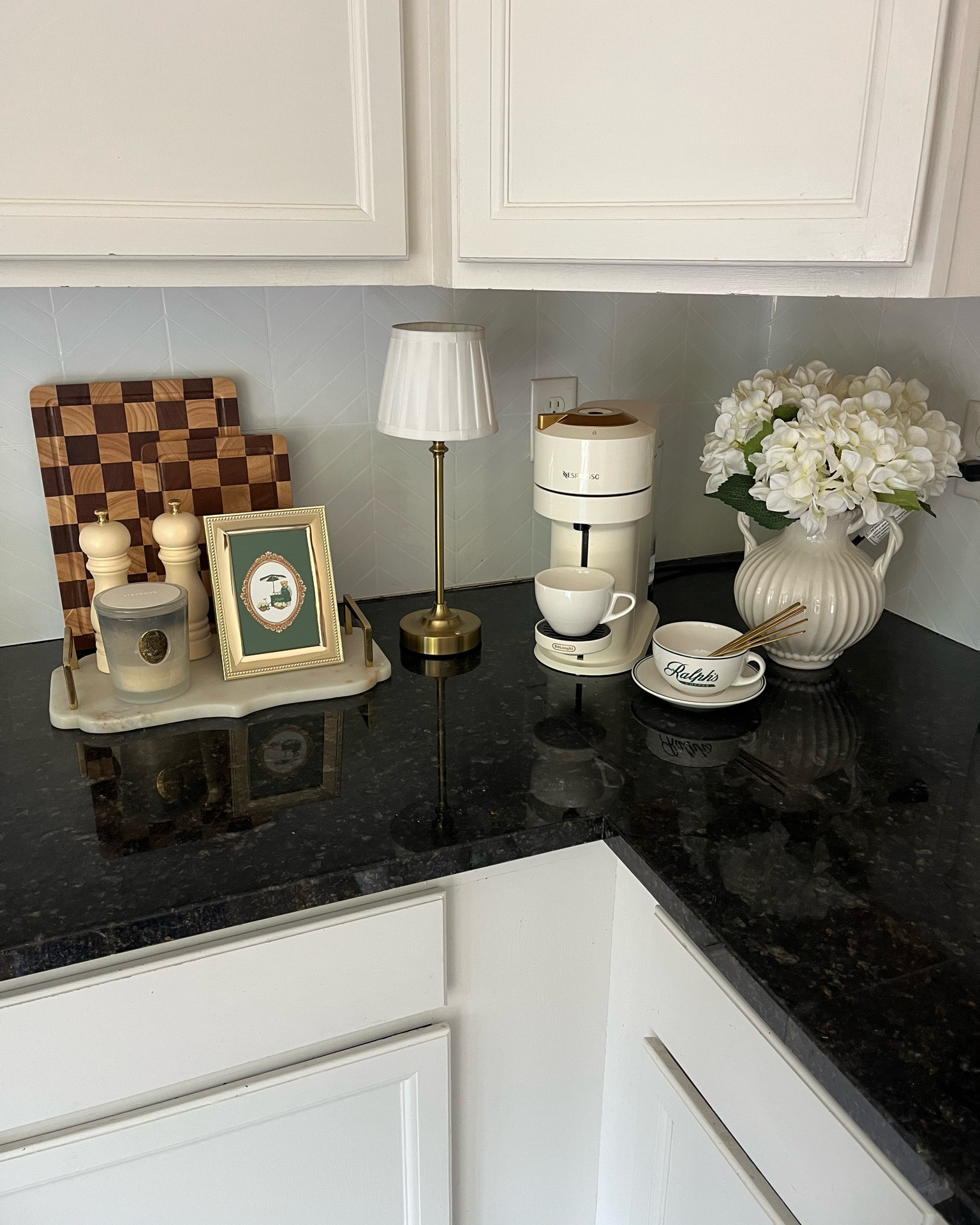 My favorite corner: the coffee bar ☕️ I added a few decor pieces & I am absolutely thrilled with how my little at-home Ralph’s Coffee bar is coming together 🧸🤍

Coffee bar, kitchen decor, coffee essentials, Nespresso, espresso machine, home decor, Ralph Lauren home decor aesthetic

#LTKHome