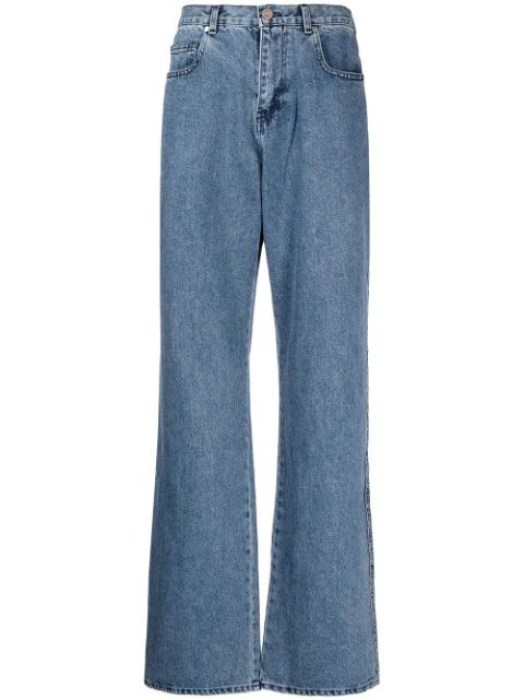 Calça jeans flare com studs | Farfetch (BR)