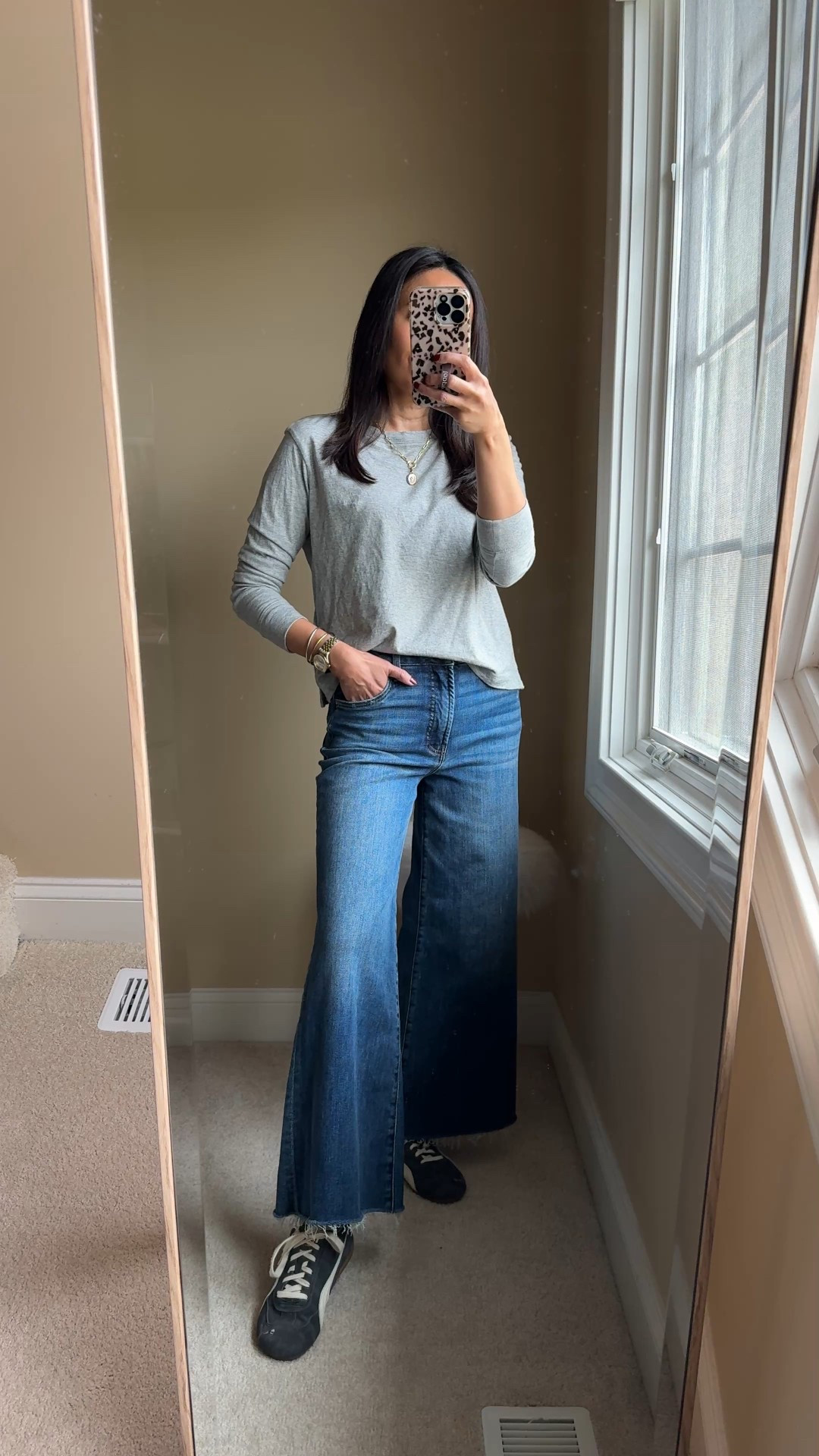 Everyday elevated winter outfit. 
Jeans are a fun wide leg style from to wear casually or dress up with a blouse and heels. 
Comfy, soft stretch denim, with a nice wash and slight whiskering details. Raw hem. 
Size down. 
Wool coat I sized up for room in shoulders. 
Favorite all cotton long sleeve t-shirt. True to size. 
Suede sneakers true to size. 
Charm necklace  


#LTKOver40 #LTKootd #LTKFindsUnder100