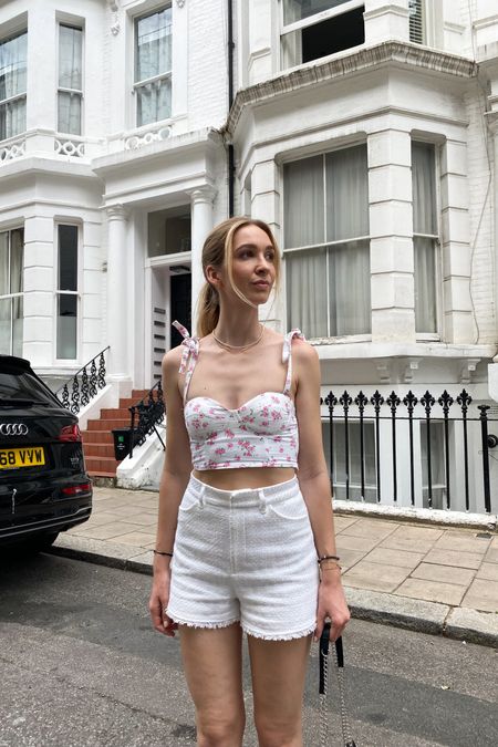 Summer outfit with white shorts and a floral corset top

#LTKeurope