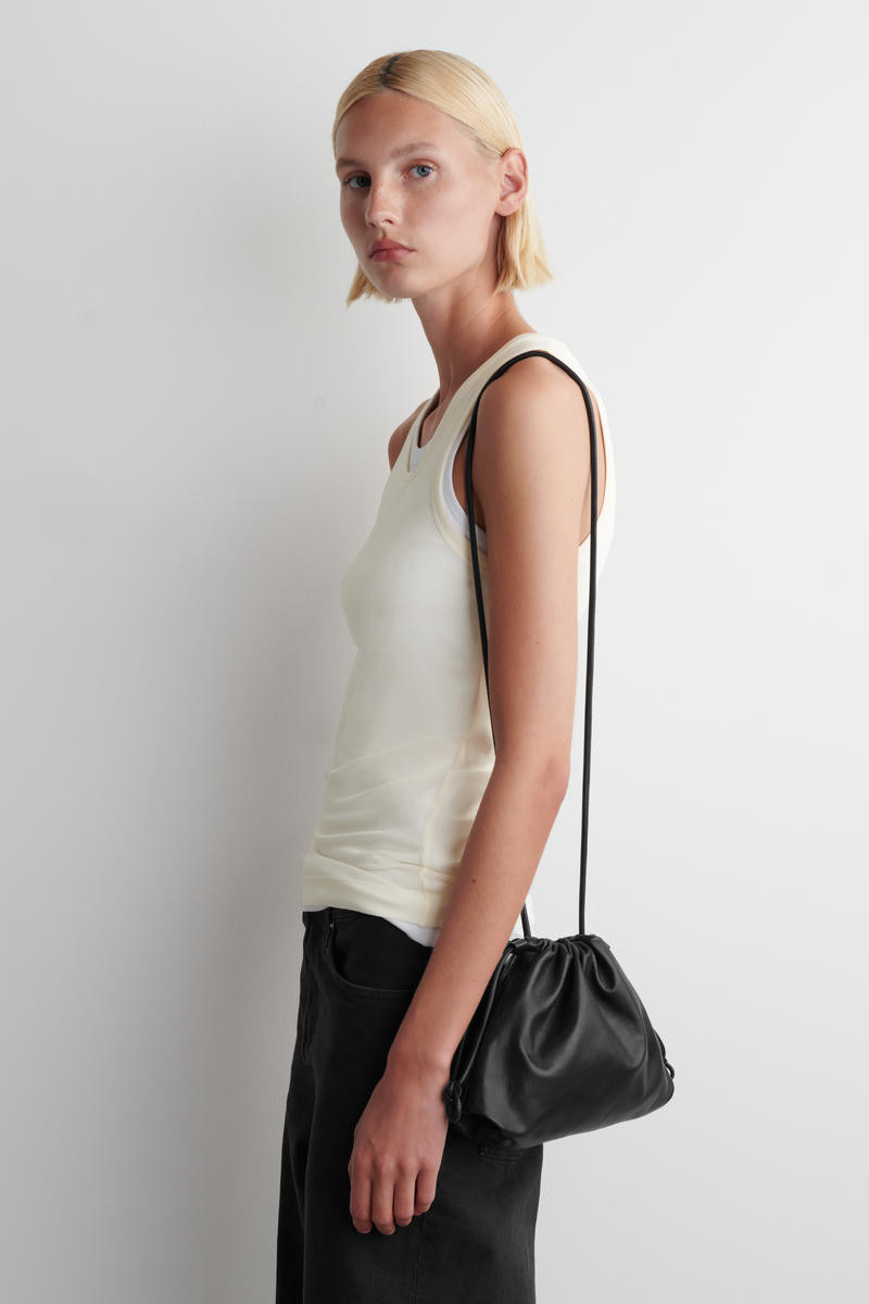 COS Women's Mini Cavatelli Clutch Bag Leather in Black | Sheep Leather/Cotton | COS (AU)