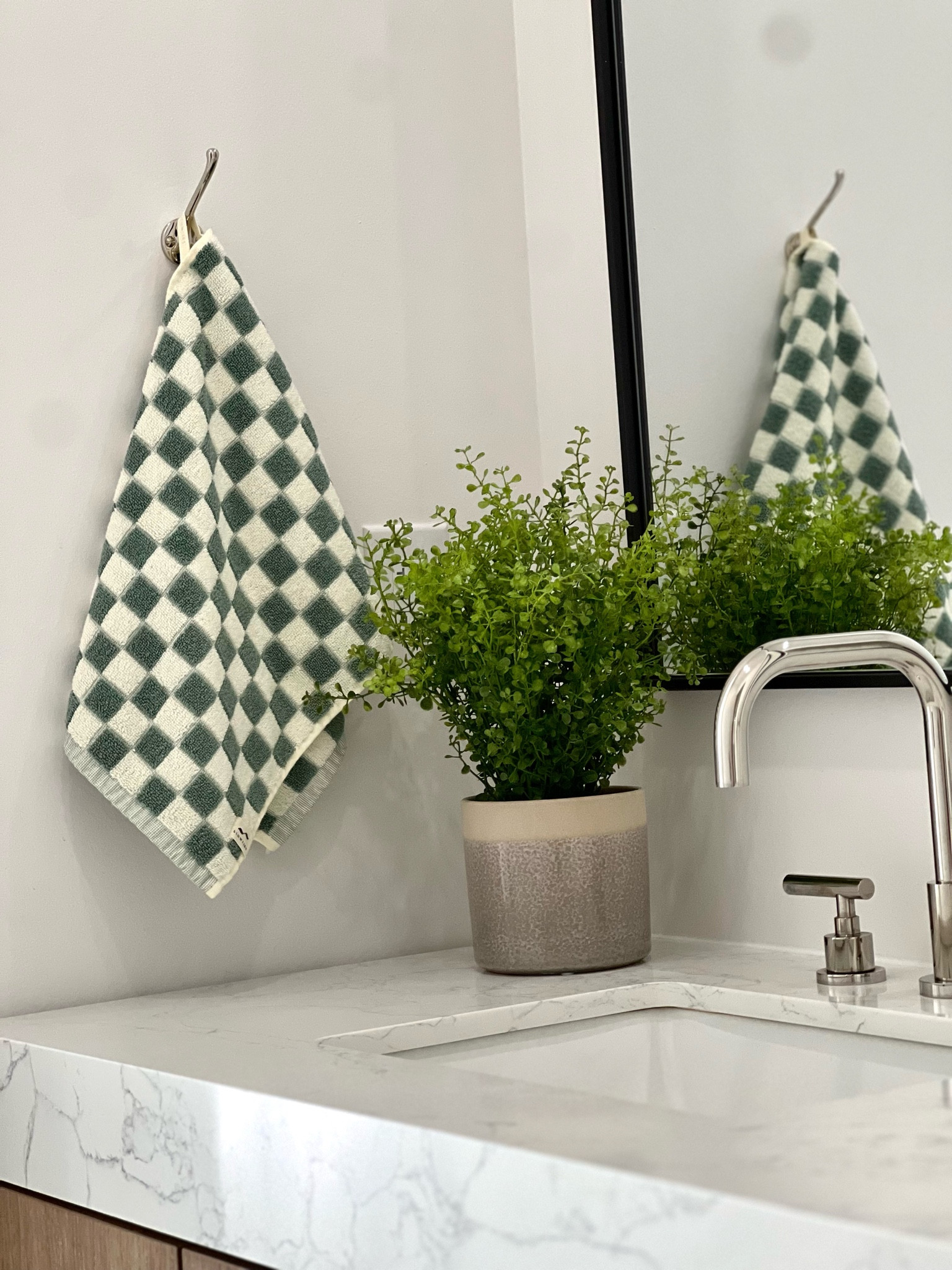 Hand towel, bathroom styling, faux plant, polished nickel faucet 

#LTKHome #LTKStyleTip