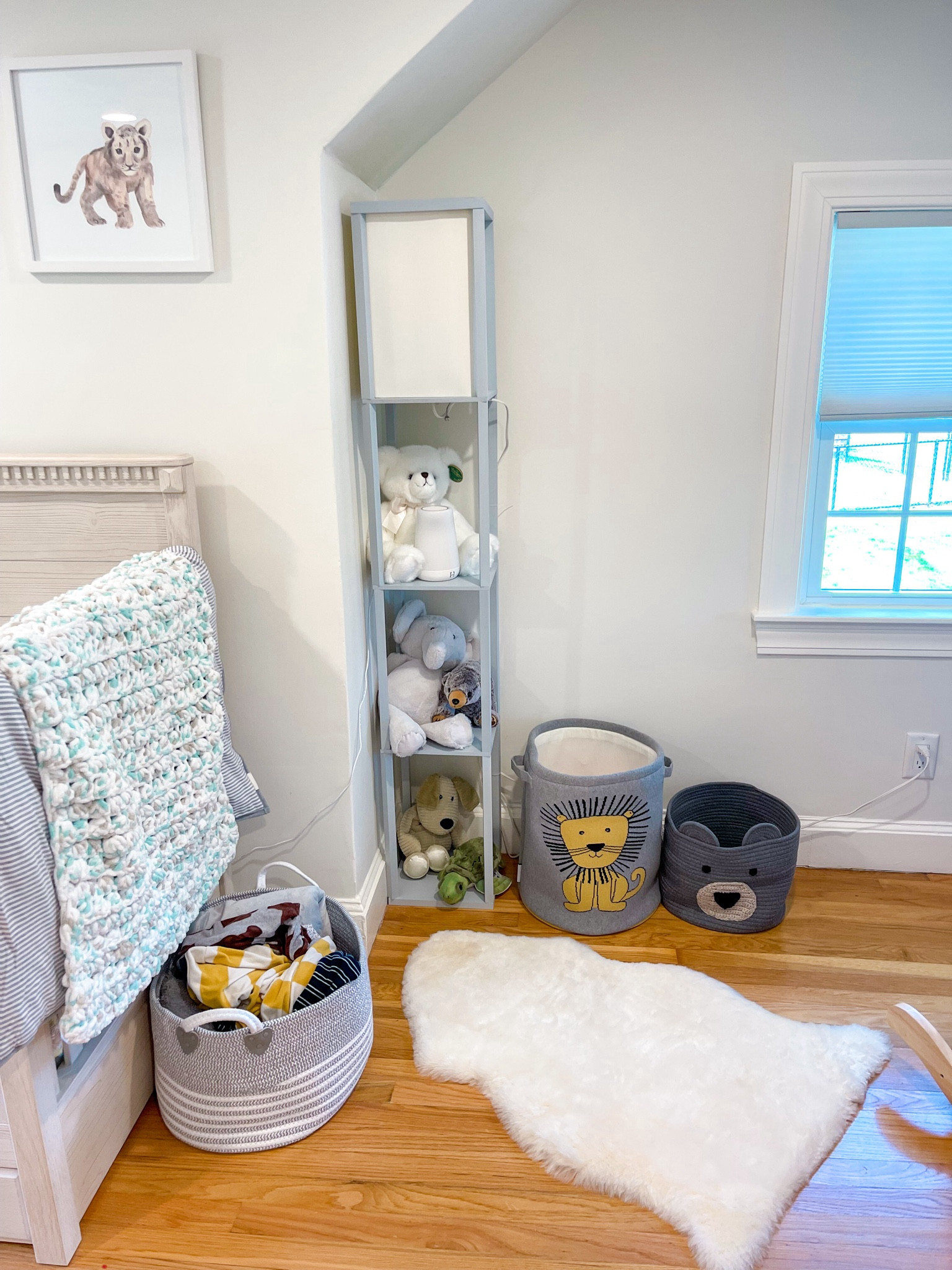 Safari jungle animal theme nursery kids room
Lamp with shelves- great for any room small space!
Lambskin rug
Lion print 
Storage baskets 

#LTKBaby #LTKKids #LTKHome