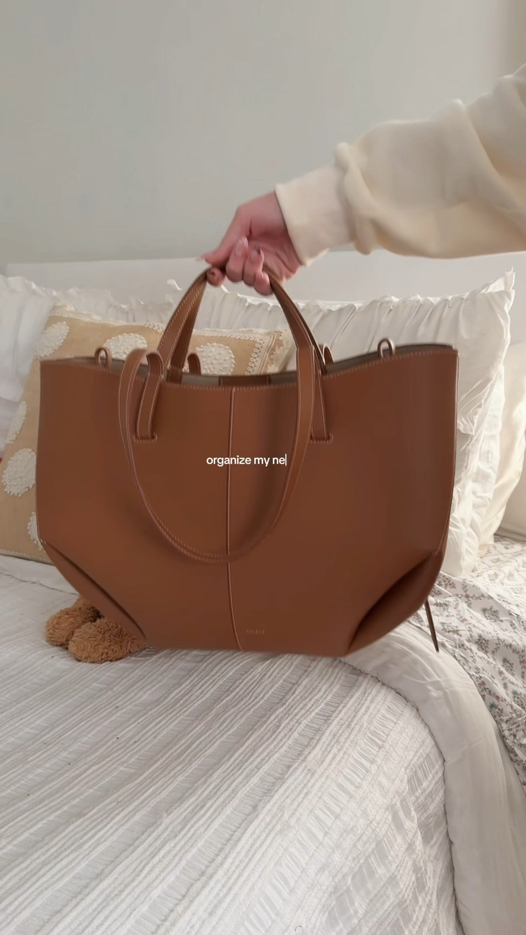 what’s in my bag 🤎 

bag charm from shopglowinggrace.com 🌟