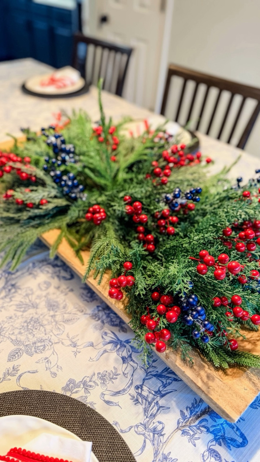 My very large farmhouse table got a Christmas makeover 🎄
After painting our kitchen cabinets a rich navy this year, I added little pops of blue into my holiday tablescape. The blue berries + blue & white tablecloth tie everything together beautifully with the classic red and green.

Pro tip: mix your greenery! I layered cedar + pine in a big wooden tray to keep the centerpiece low so guests can see each other. Add a simple charger, your favorite Christmas plate, and a folded napkin—and you’ve got an easy, elevated holiday table.

All items are Amazon finds 🤍✨

#LTKHoliday #LTKSeasonal #LTKHome