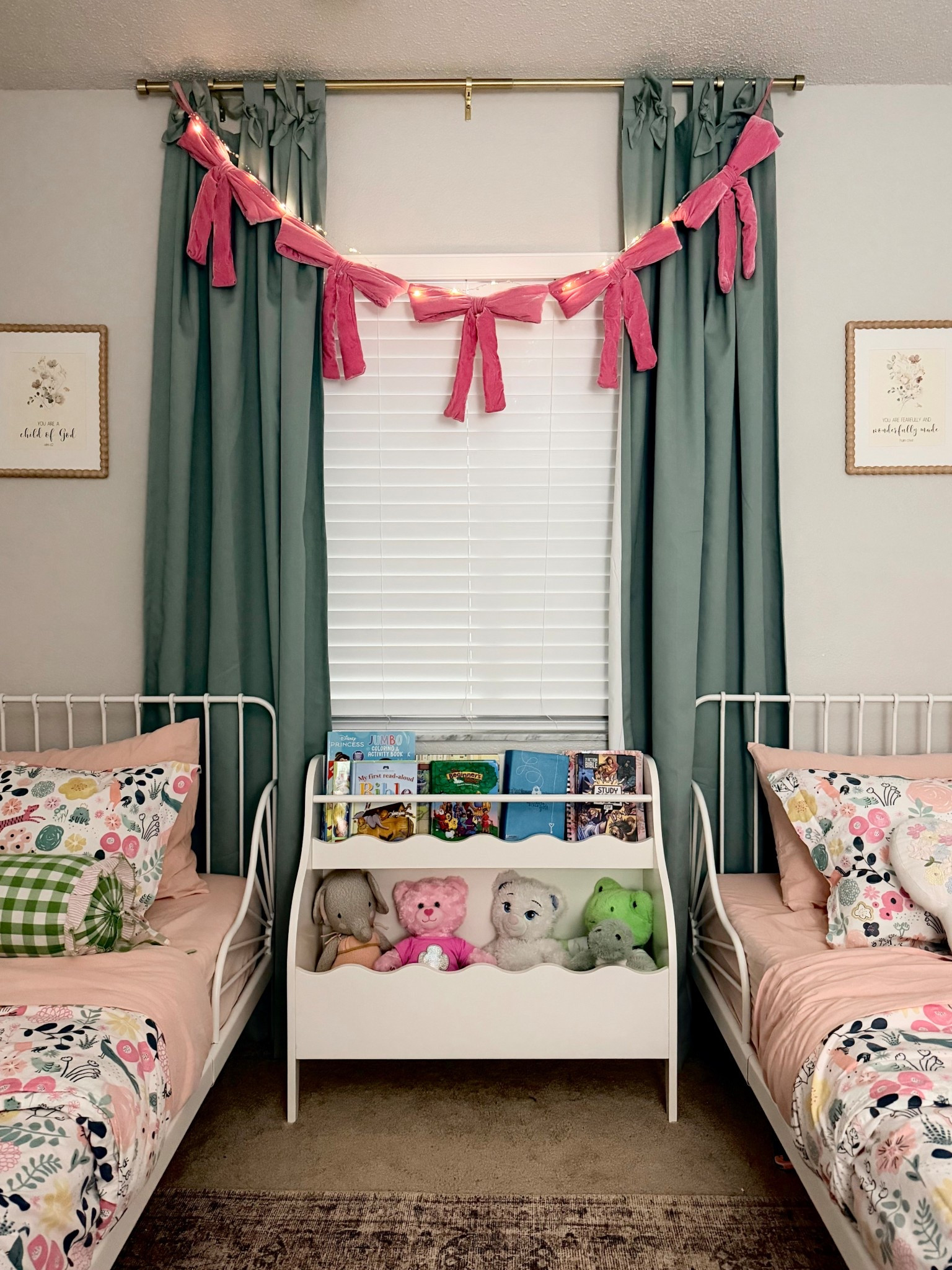 Just changed the girls side table to this cute bookrack . They love their books and reading before bed , so this mommas heart gets happy that they do !!! I also added this velvet bow garland , added lighting as well !!

#LTKmomlife #LTKKids #LTKHoliday