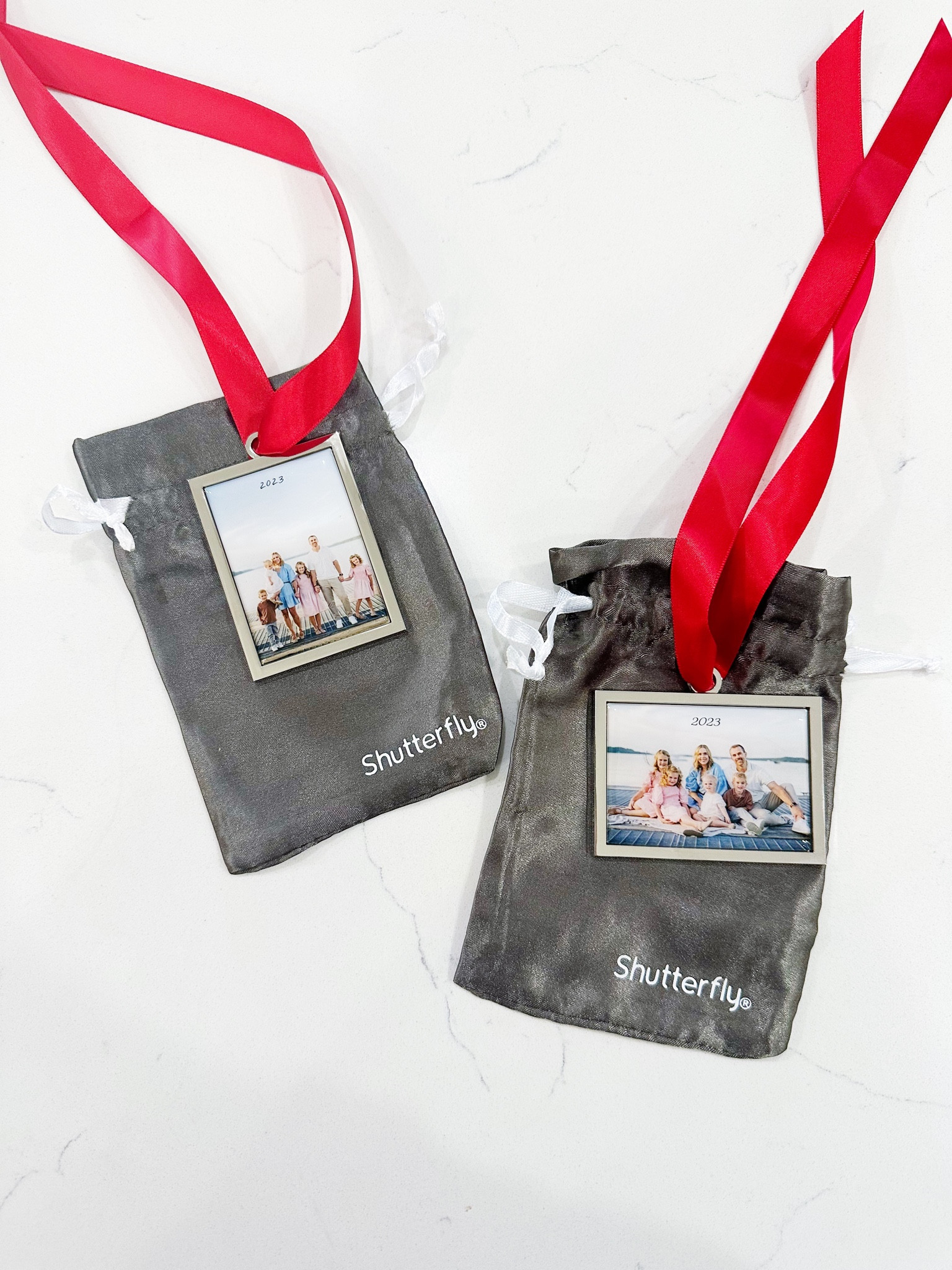 Keepsake photo ornaments for each year.

#LTKGiftGuide
