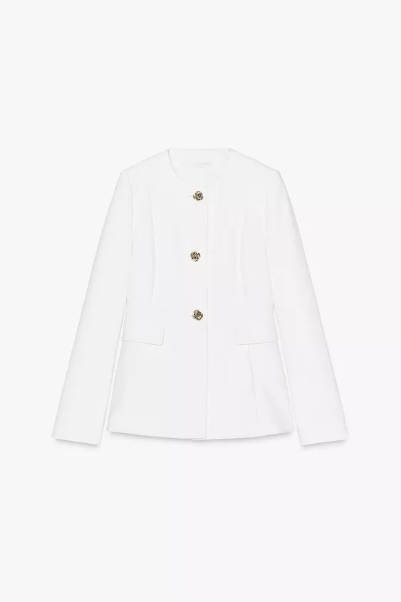 Round neck, long sleeve blazer with shoulder pads. Front flap pockets. Front fastening with embos... | Zara UK