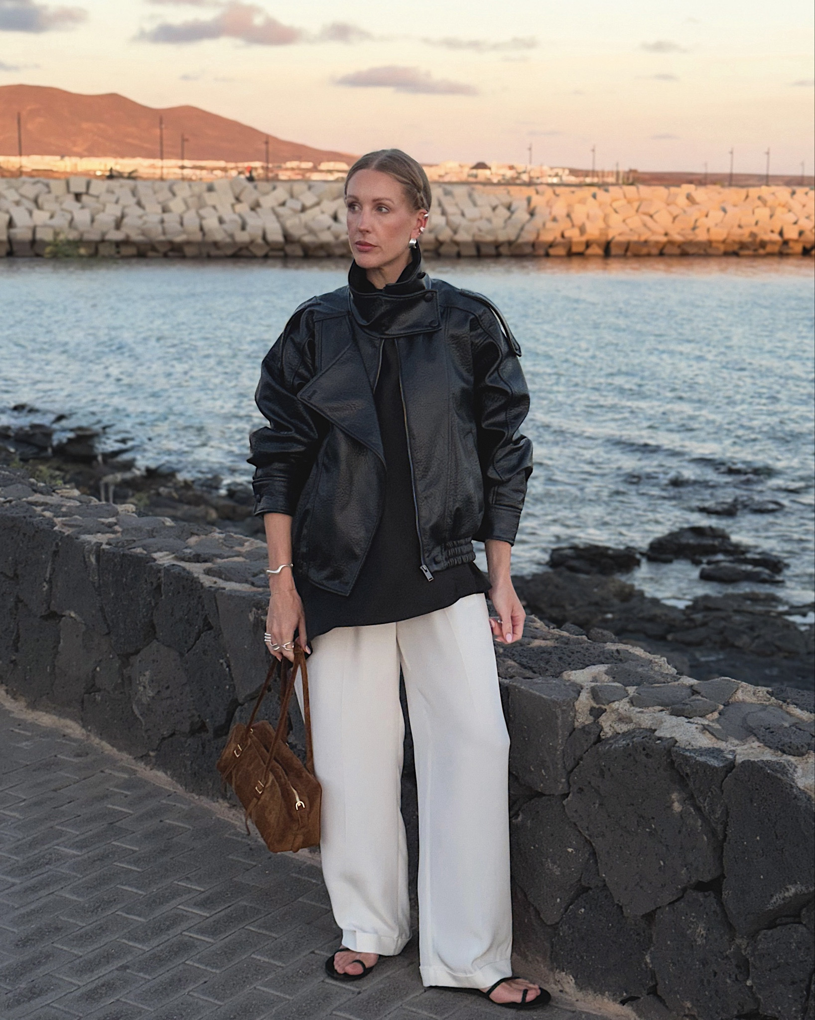 Zara jacket - leather bomber jacket - white wide leg trousers - Zara satin halterneck top - brown suede handbag - east west bag - minimal style - Zara outfit #zara - holiday outfit Lanzarote 

#LTKuk #LTKeurope #LTKautumn