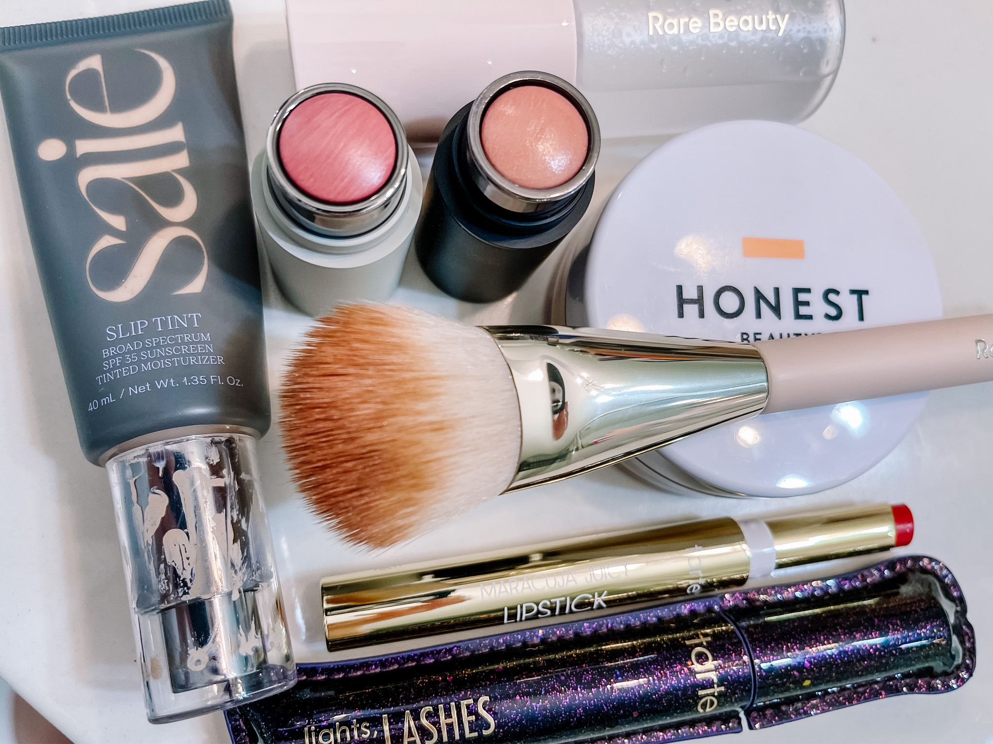 Light summer, dewy makeup! There are many cream stick products and a tinted moisturizer with SPF. 

Westman Atelier Mini Baby Cheeks, Petal
Westman Atelier Lit Up Highlight, Nectar
Tarte Cosmetics Maracuja Juicy Lipstick, Pinky Coral

“Exact products” can be found at Sephora, Ulta, or Target. The “similar products” are the products at the brands website to make it easier for you to shop your preference  

#LTKbeauty #LTKstyletip #LTKSeasonal