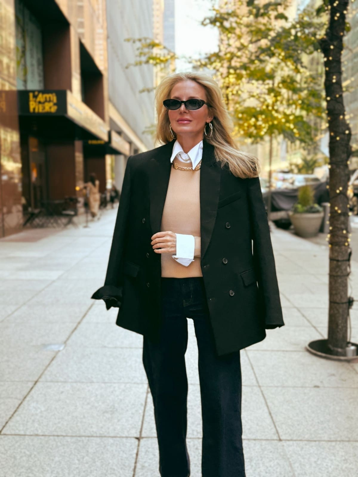 This sweater is one of those rare finds that does the accessorizing for you. It has a gorgeous gold chain link detail at the neckline and built-in white cuffs. I layered it over the same white cropped, sleeveless shirt from above. I think the shirt looks so good, it looks like part of the sweater!

Special pieces like this take all the guesswork out of getting dressed. Just throw it on with jeans and your favorite sunglasses, and suddenly you have a thoughtfully styled outfit that you spent no effort putting together. That kind of polish and practicality? Totally justifies the price tag.

 Use Code: BFRIGCSF:
• Spend $150, Get a $75 Gift Card
• Spend $500, Get a $125 Gift Card
• Spend $1,000, Get a $250 Gift Card
• Spend $3,000, Get a $750 Gift Card

#LTKSeasonal #LTKOver40 #LTKCyberWeek