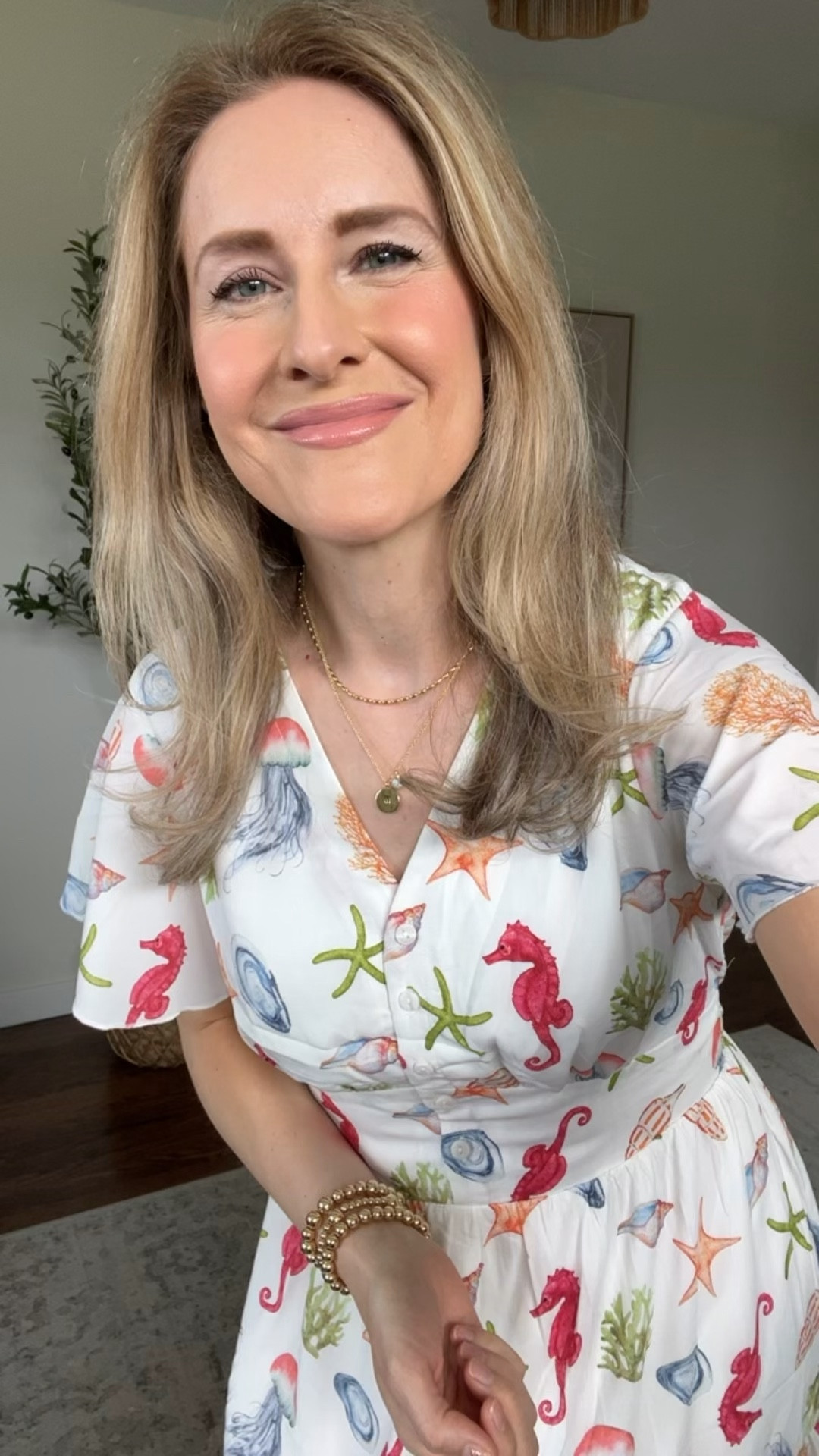 Amazon dress that checks all the right boxes! I love this sea life print but also comes in other prints. I sized up one size to a medium. I don’t think you have to size up but I like the fit on this. #amazonfashion spring break vacation coastal beach dress 