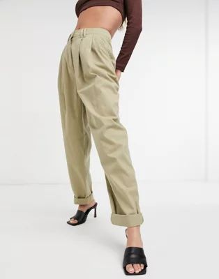 ASOS DESIGN ovoid pleated front peg pants in sandstone | ASOS (Global)